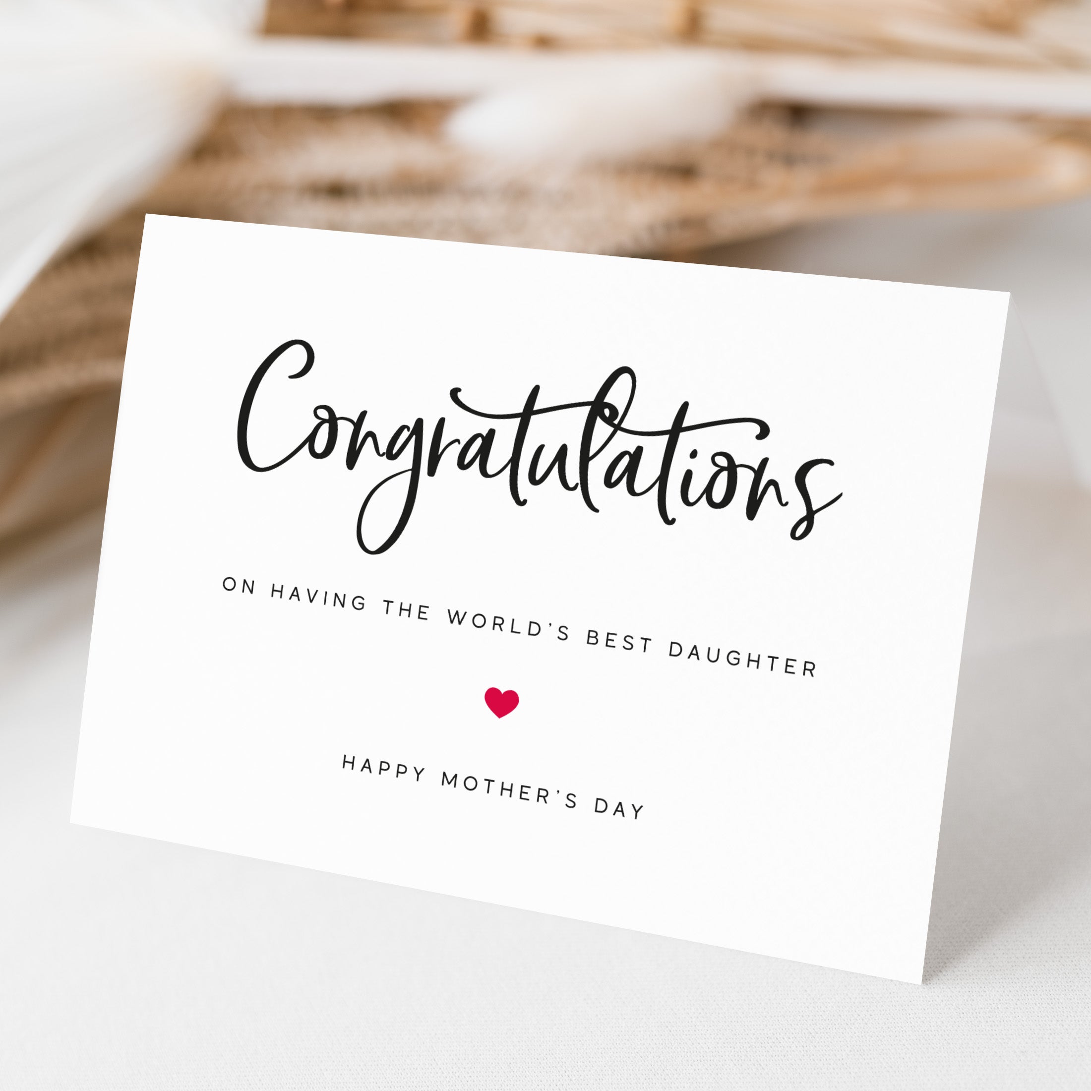 Greeting card with 'Congratulations on having the world's best daughter' text on a light background
