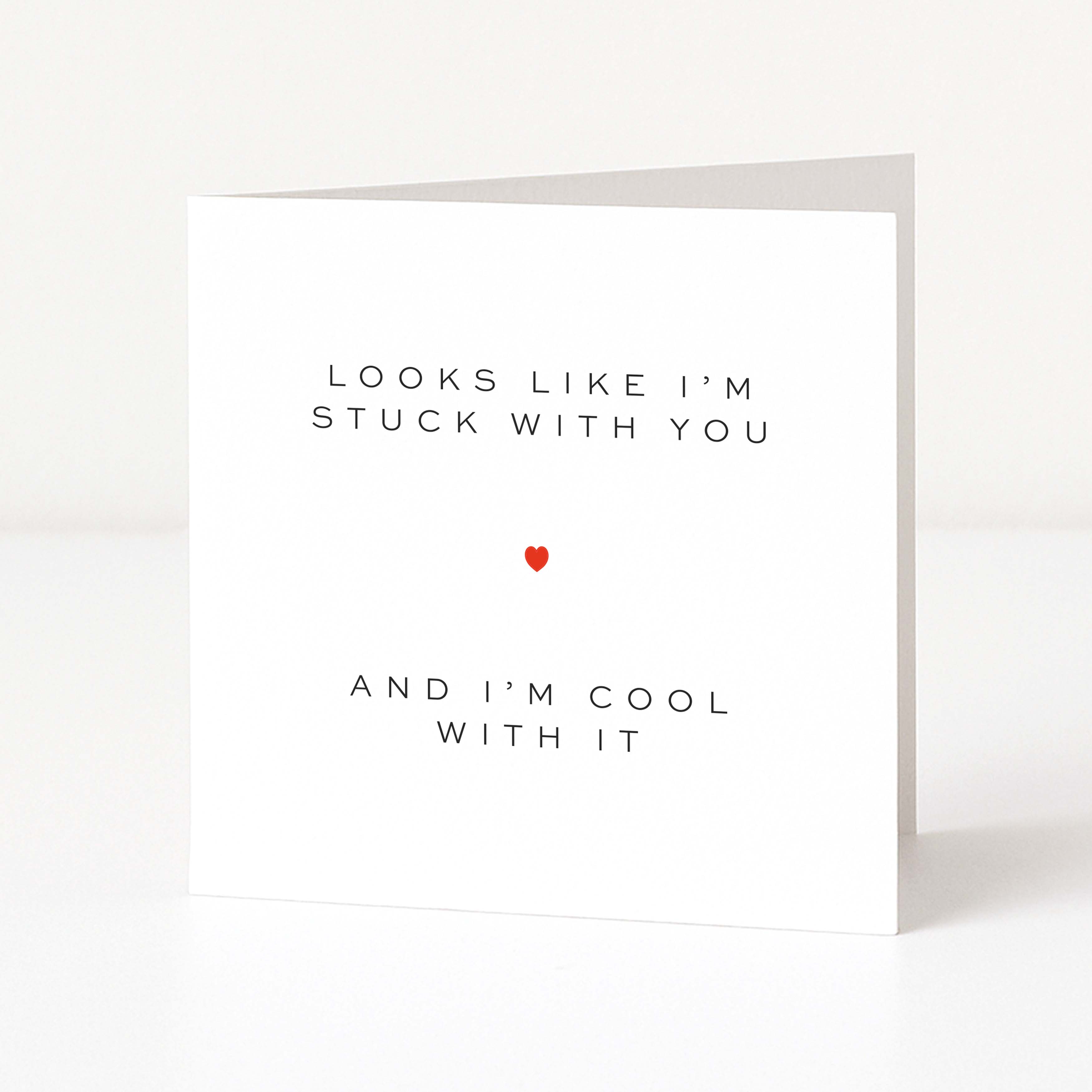 Card with text 'Looks like I'm stuck with you and I'm cool with it' and a red heart on a white background