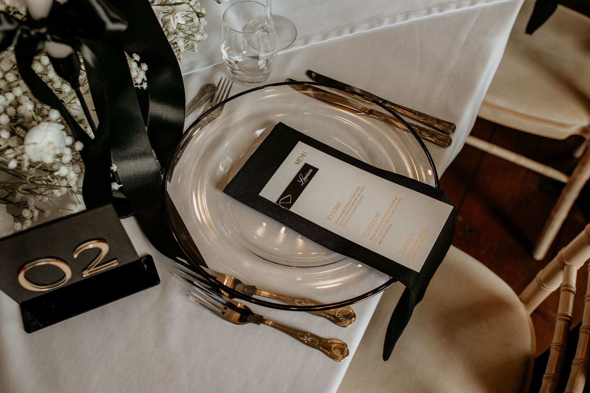 gold foiled wedding menu with black and white name tag