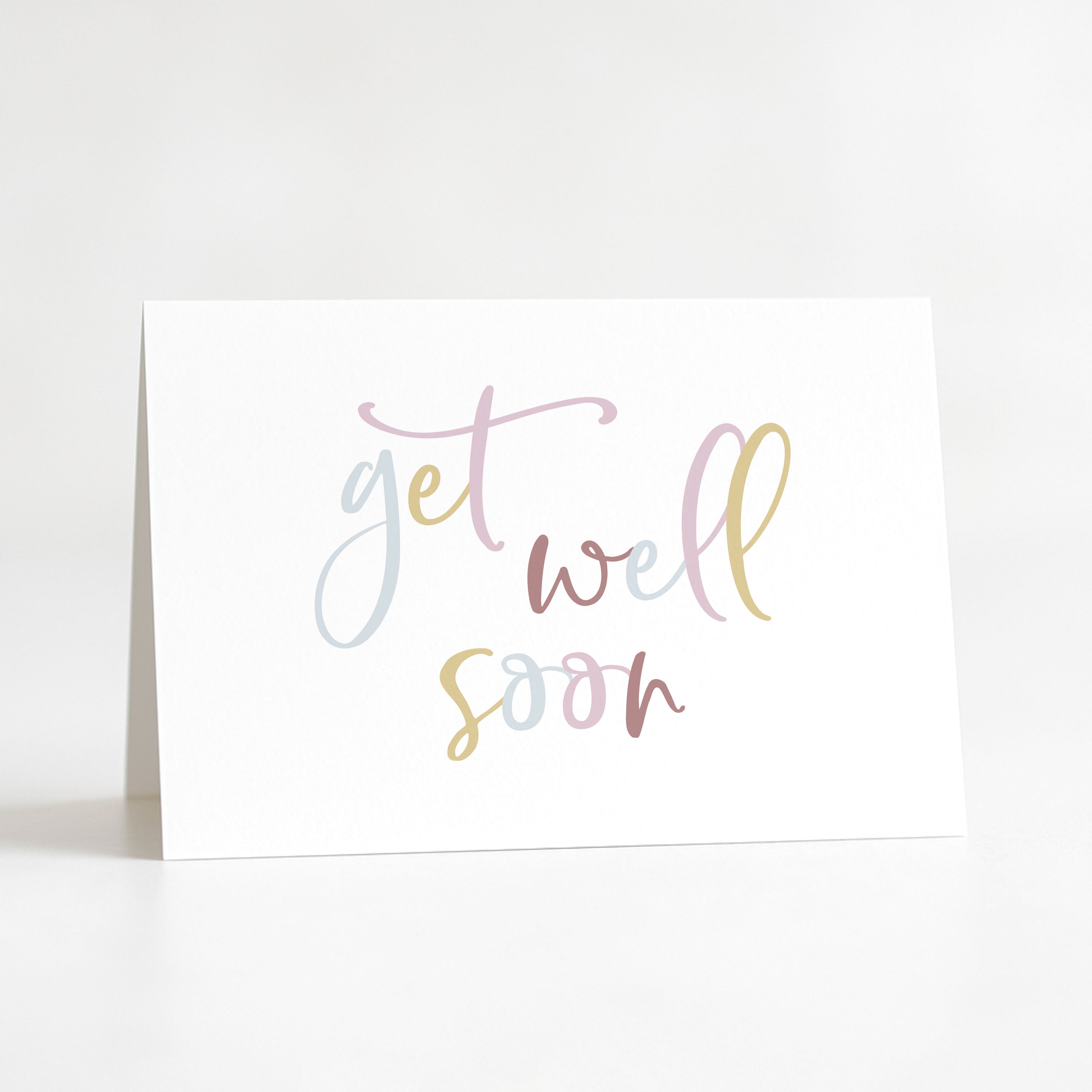 Greeting card with 'get well soon' text in pastel colors on a white background