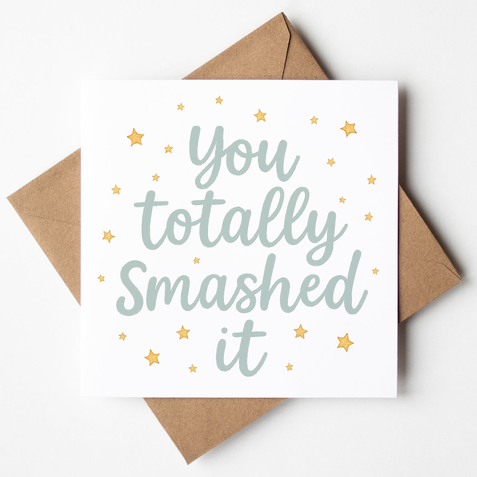 Motivational card with 'You totally smashed it' text and stars on a white background with a brown envelope.