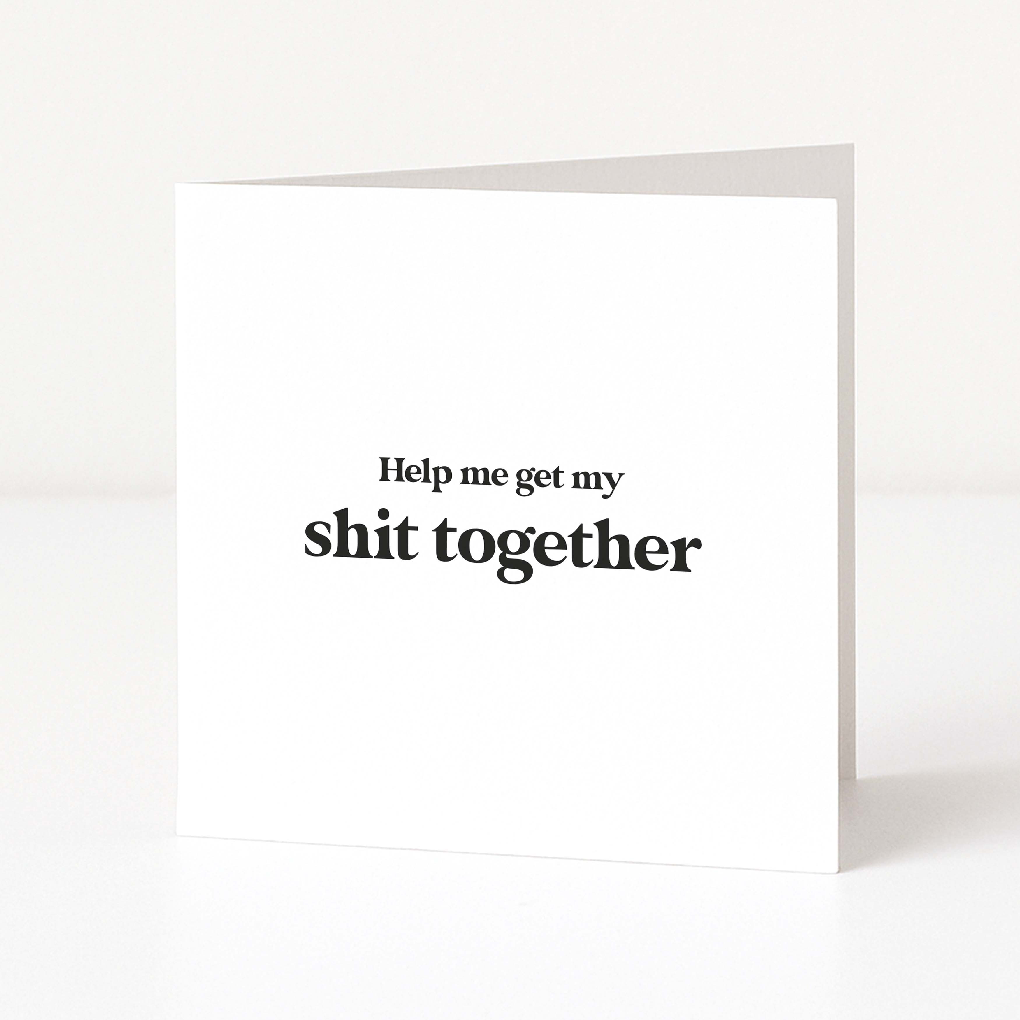 white card saying "help me get my shit together" on white background
