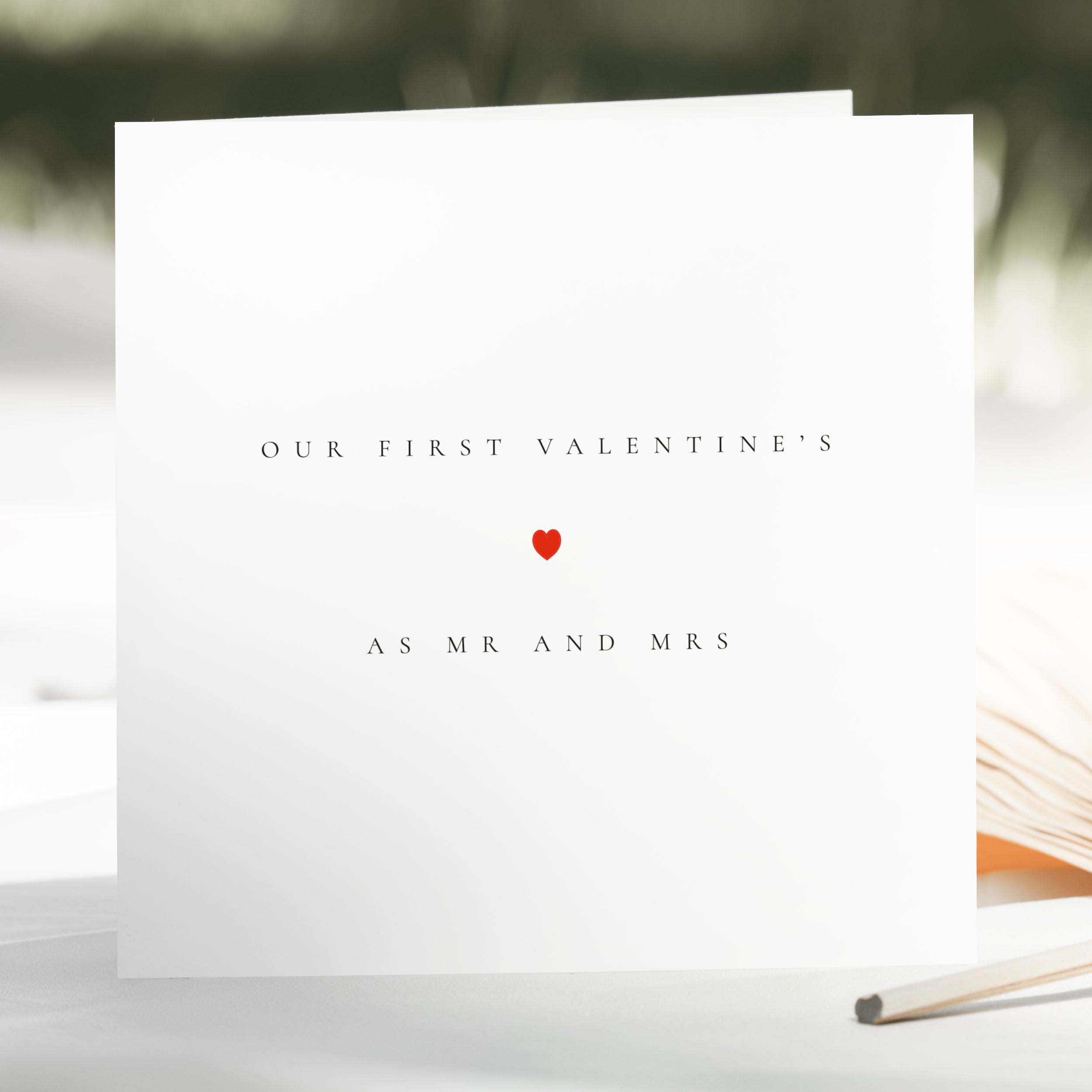 Greeting card with 'Our First Valentine's As Mr and Mrs' text and a red heart on a white background.