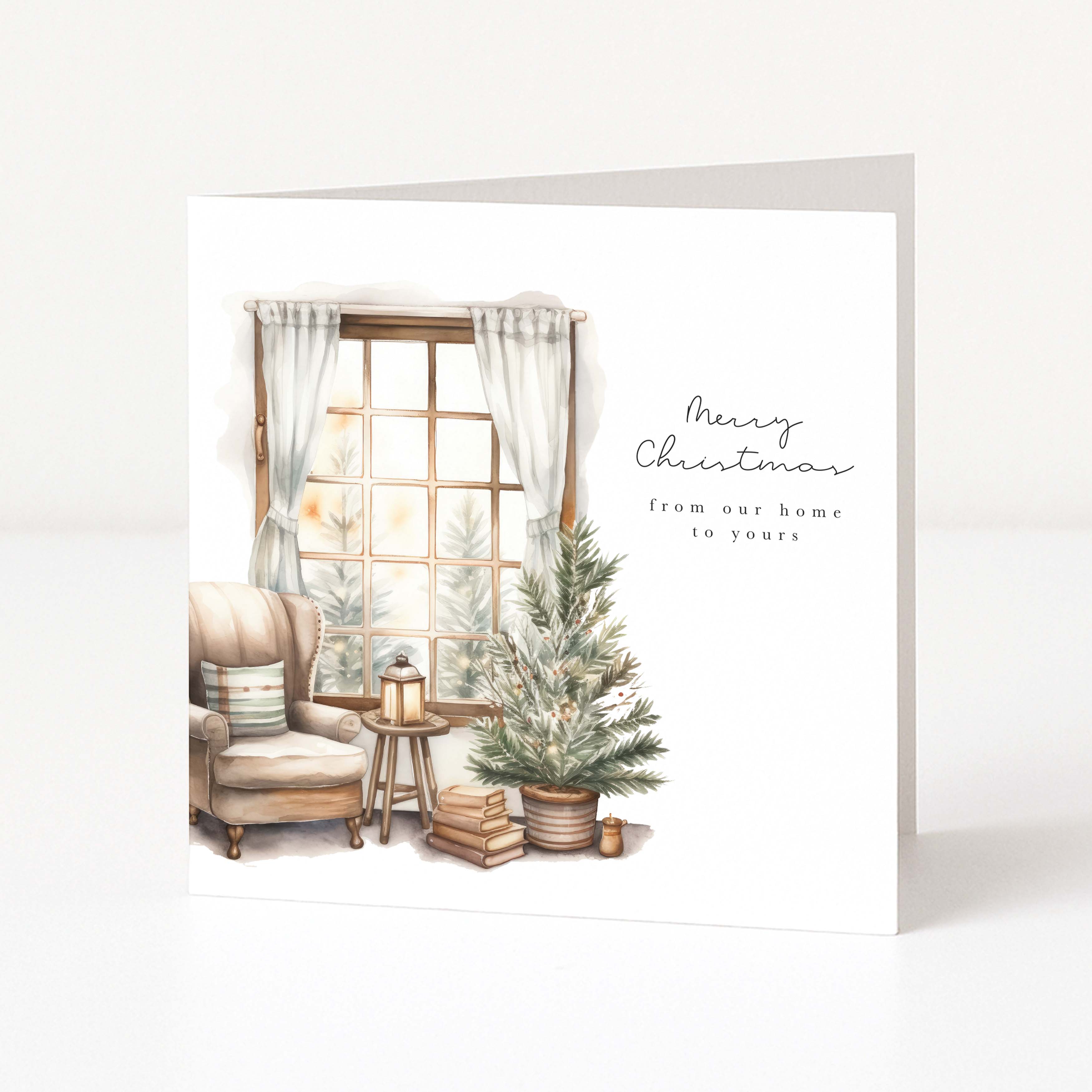 A square Christmas greeting card with a watercolor-style illustration of a cozy living room scene, including an armchair, window, small tree, and books, with the text 'Merry Christmas from our home to yours' on a white background.