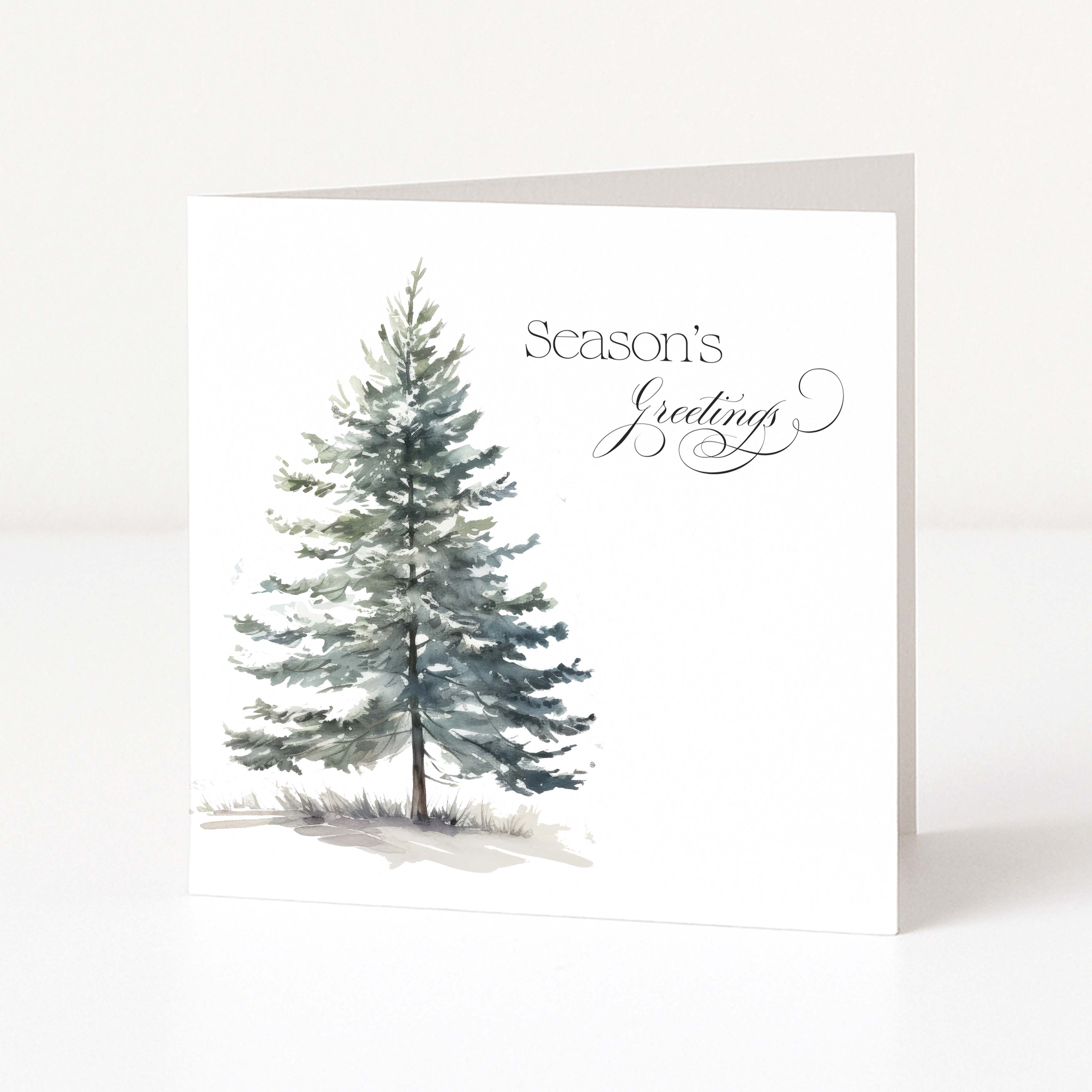 A white Christmas greeting card standing upright, featuring a watercolour-style evergreen tree on the left and the words 'Season's Greetings' in black script on the right.