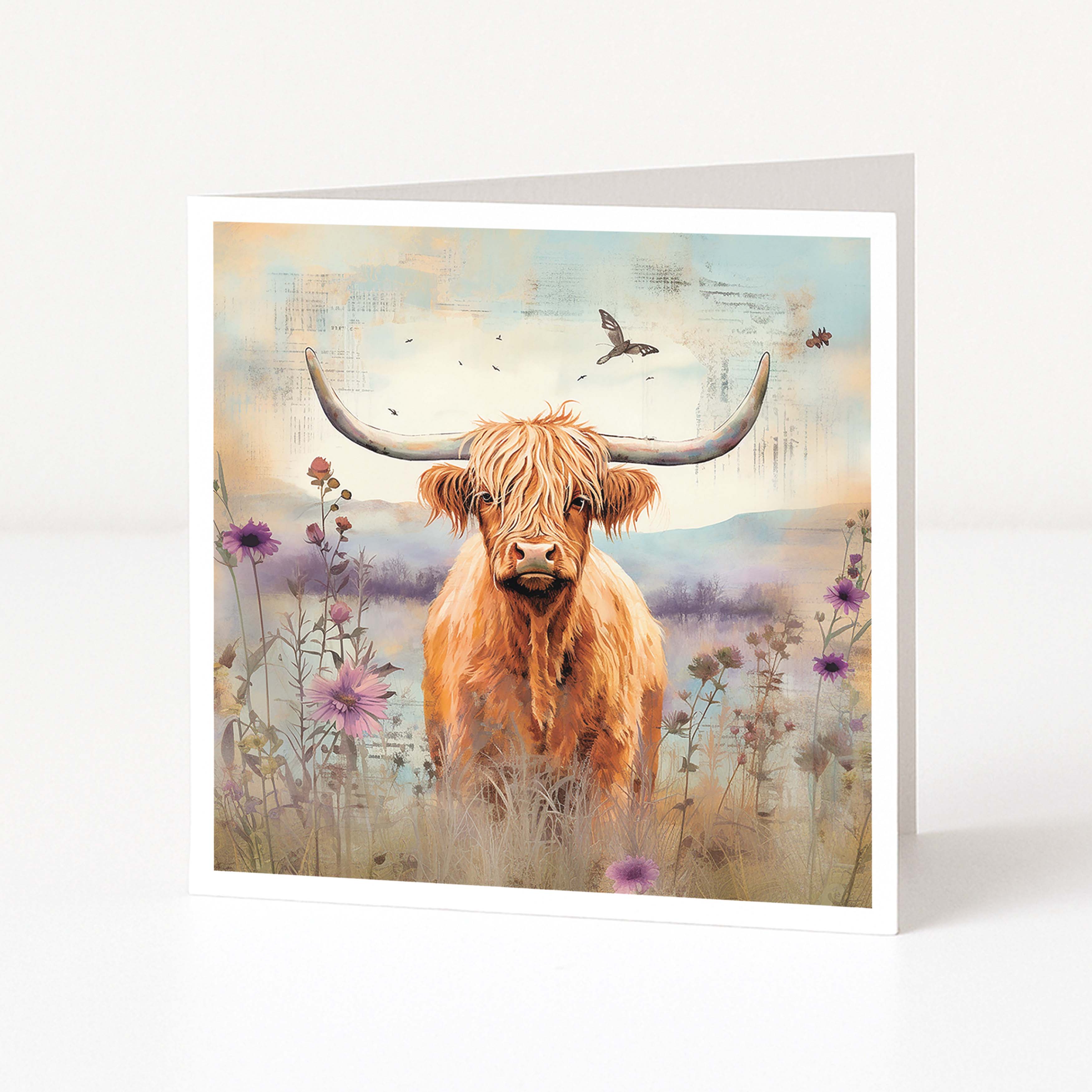 Greeting card with a highland cow in a field of flowers and birds.