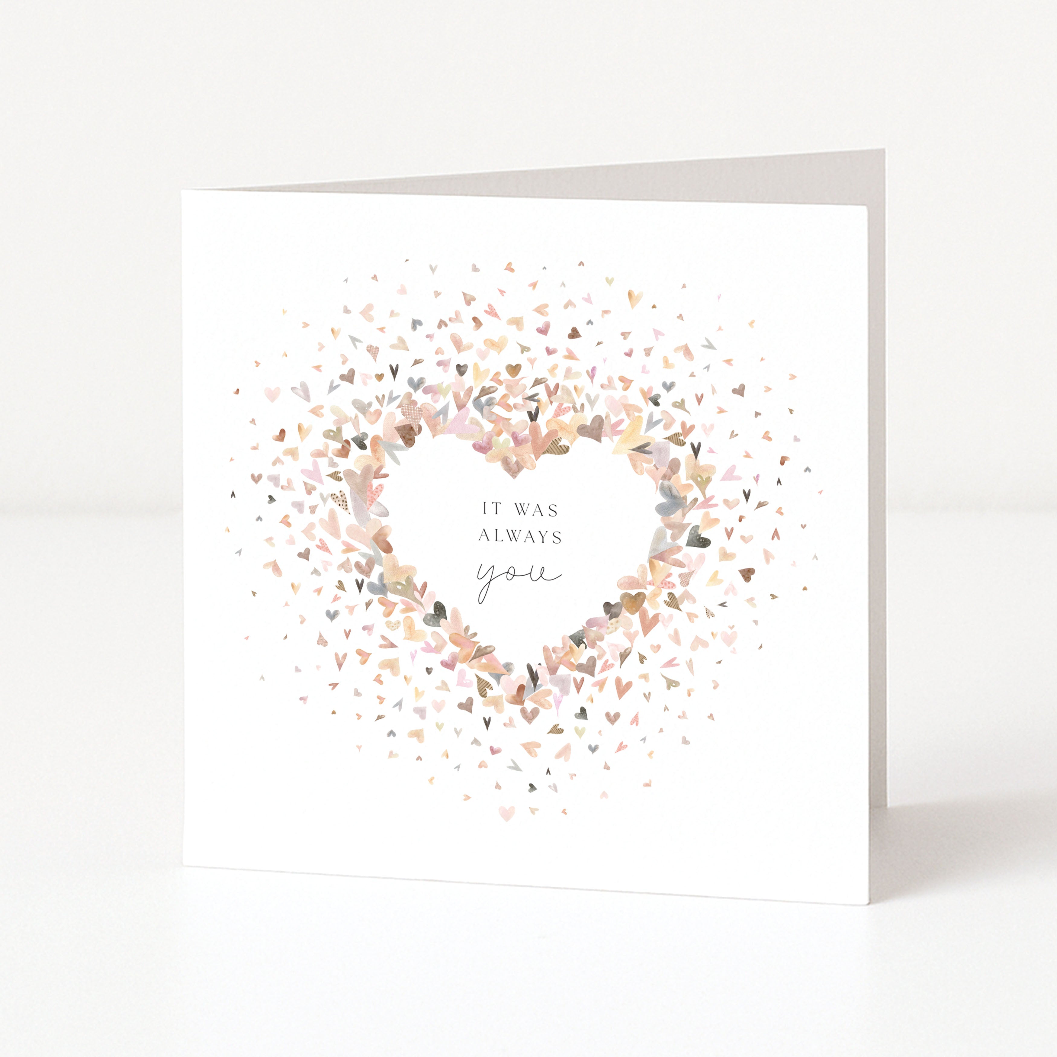 Greeting card with heart confetti design and text on a white background