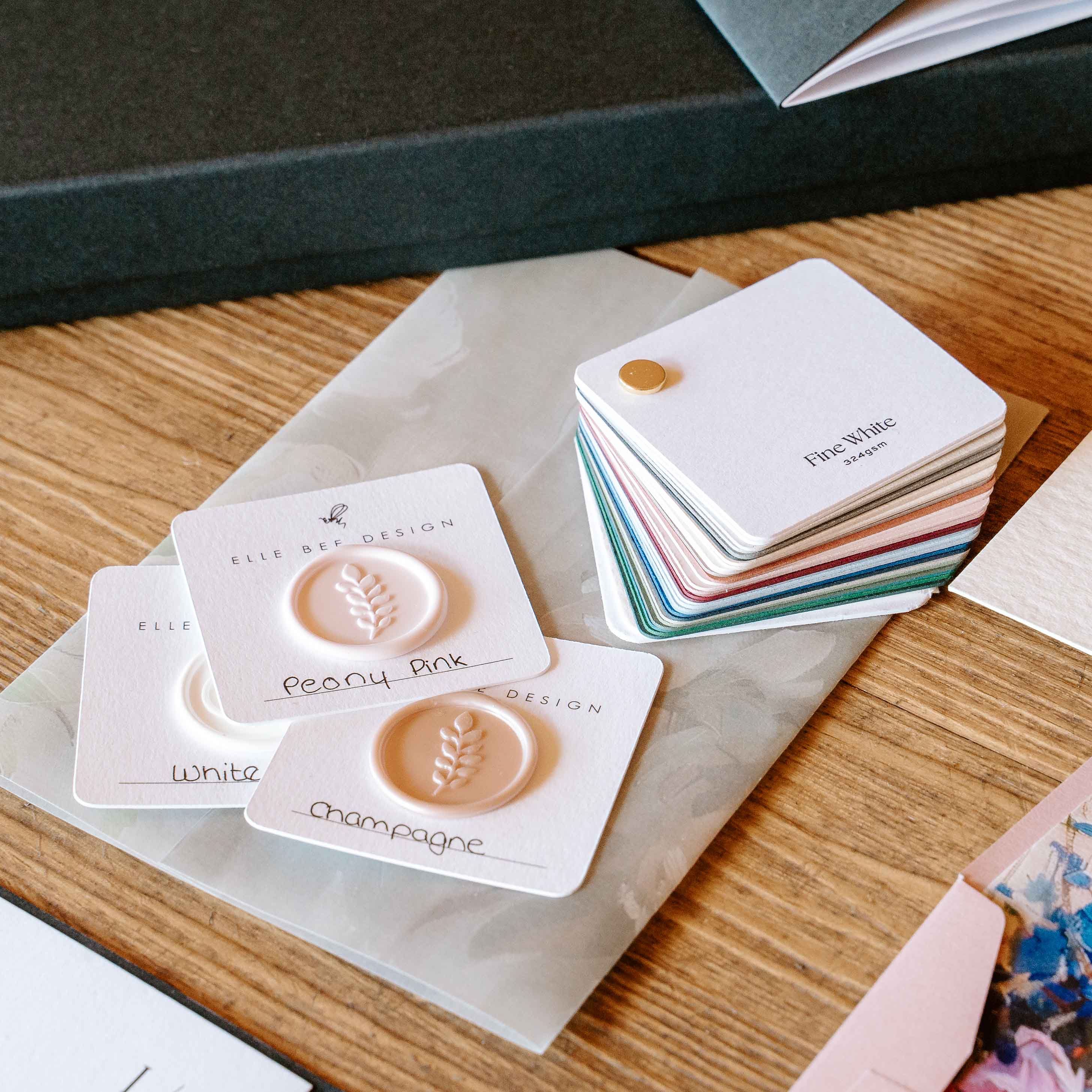 Colour swatches and sample cards on a wooden surface