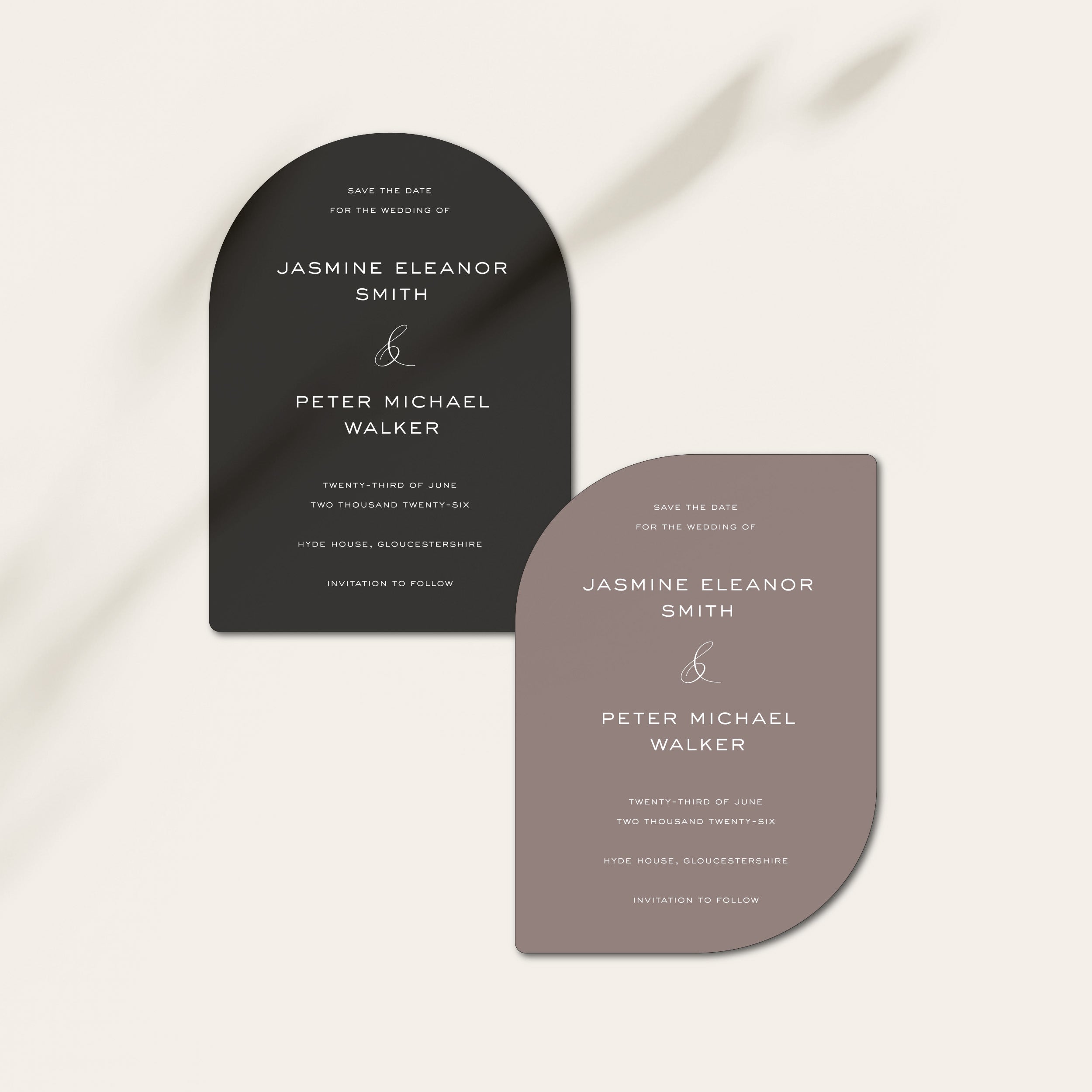 Two curved wedding save the date cards on a white background