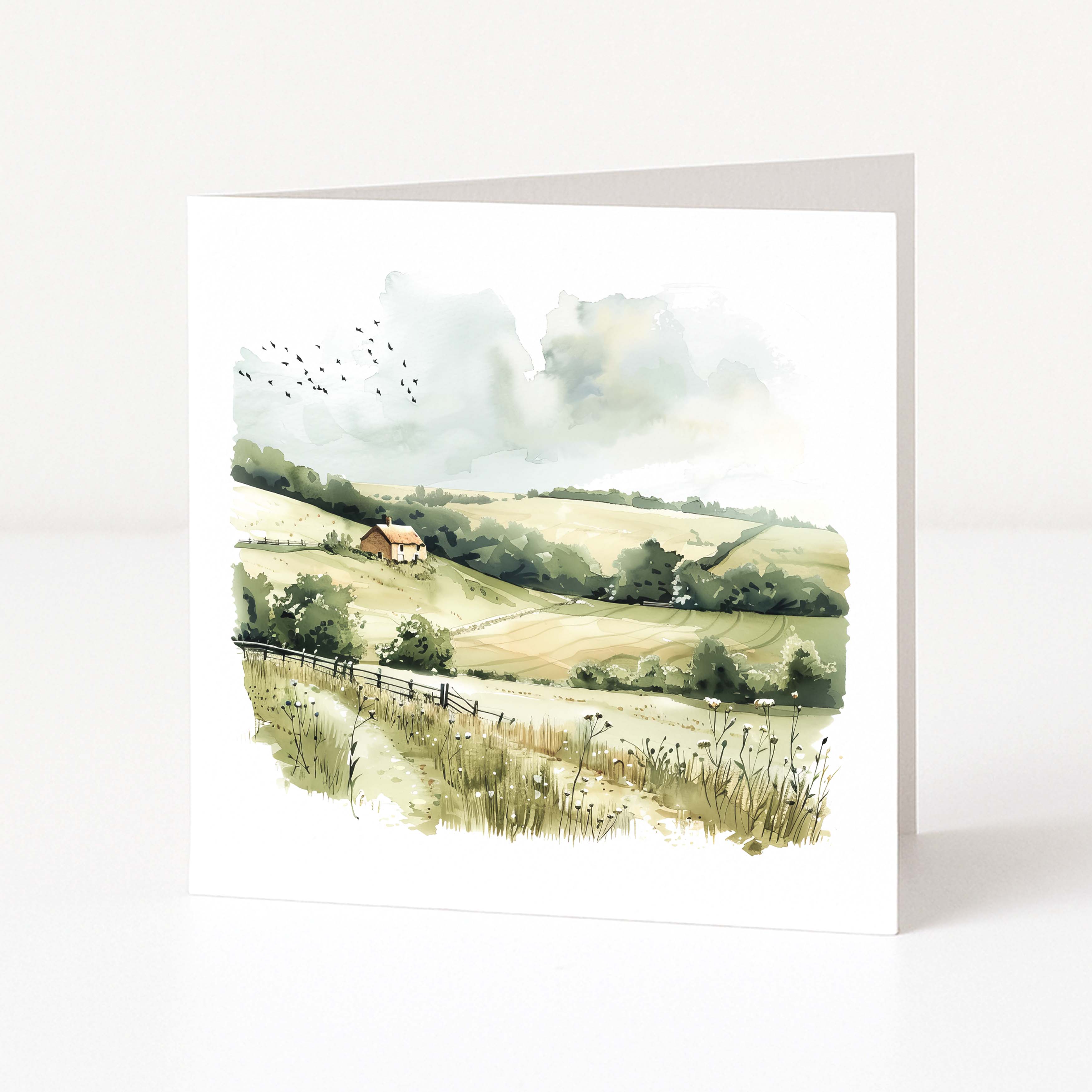 Greeting card with a scenic landscape illustration of a house on a hill.