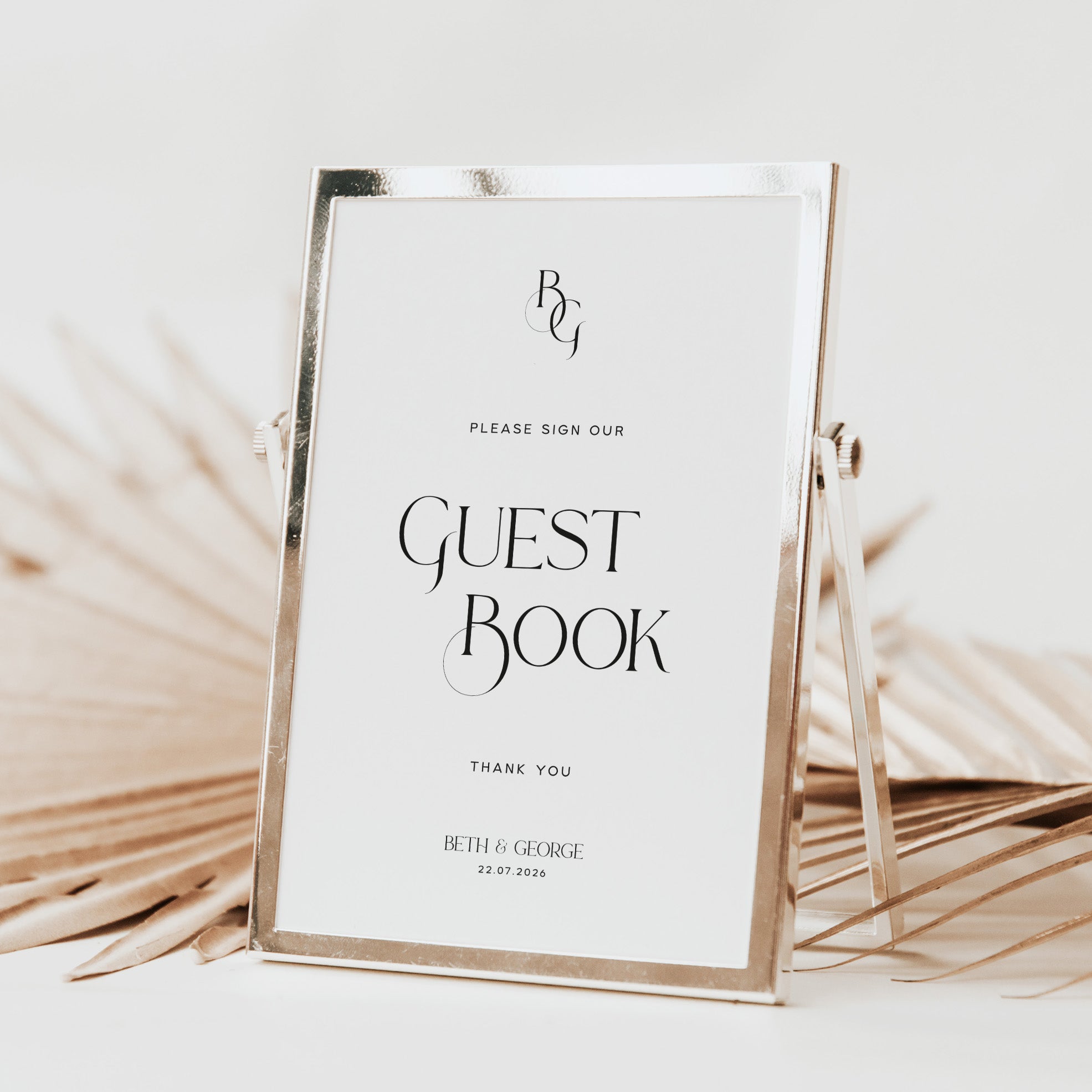 Guest book sign for wedding reception with gold frame on a white background
