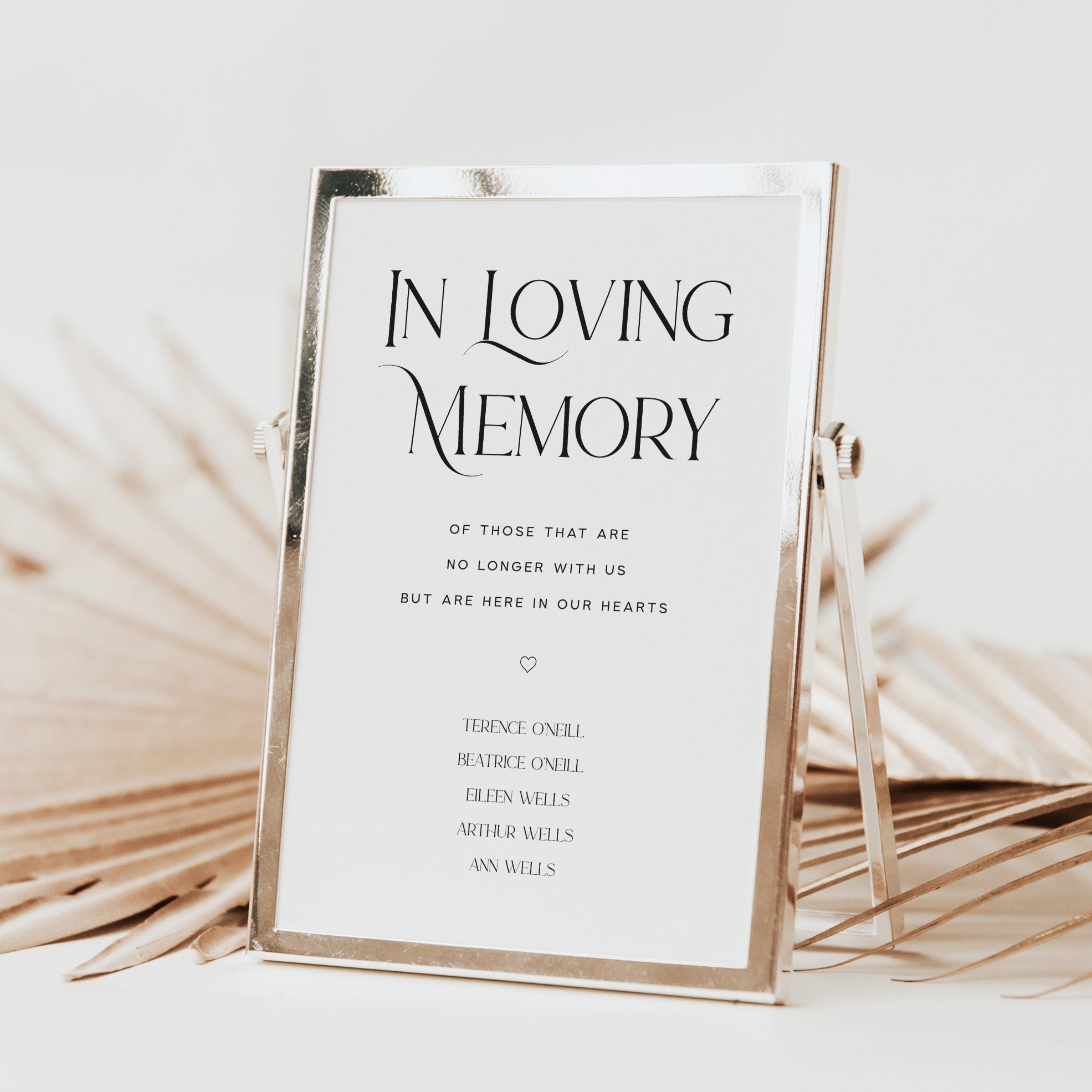 Framed 'In Loving Memory' sign for weddings with names on a neutral background