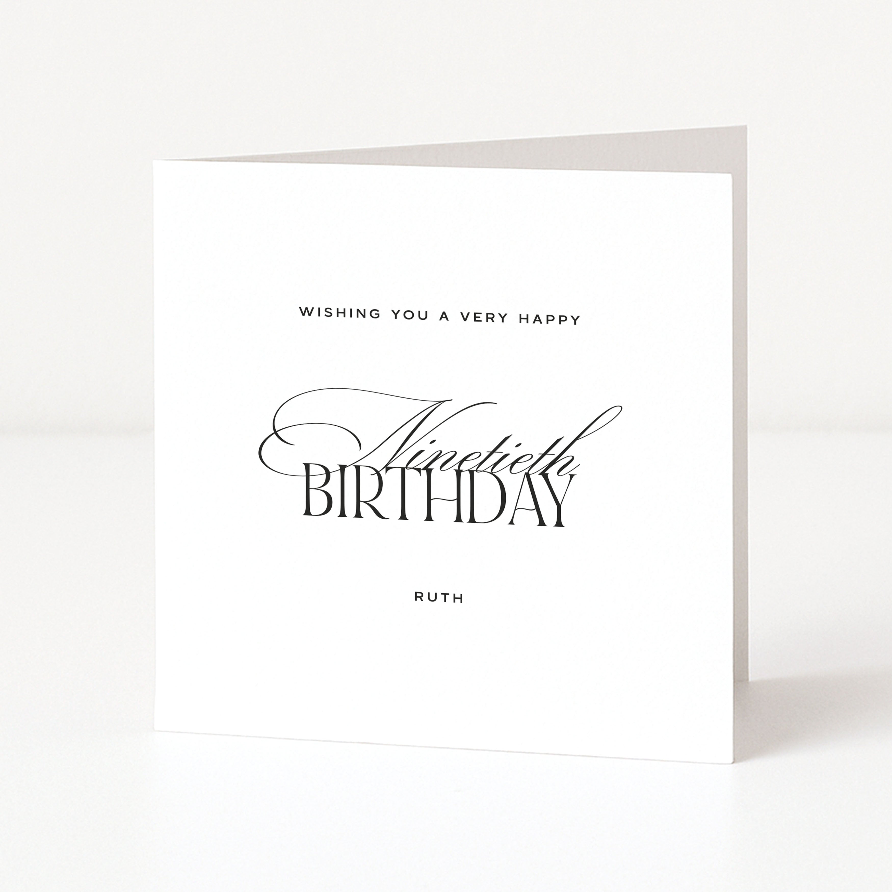 Personalised white 90th birthday card with elegant black calligraphy and the example name Ruth