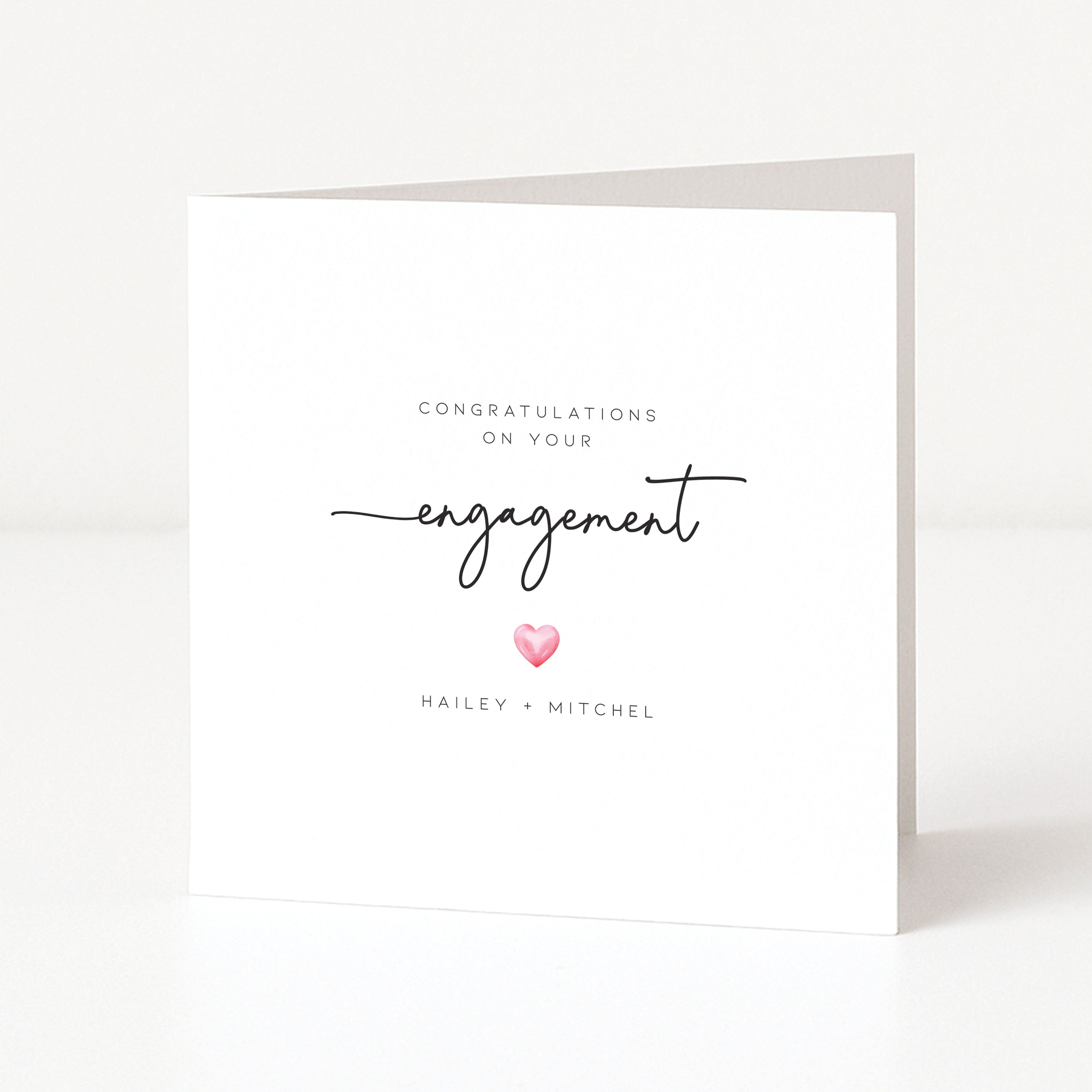 Engagement card with 'Congratulations on your engagement' text and a heart symbol on a white background.