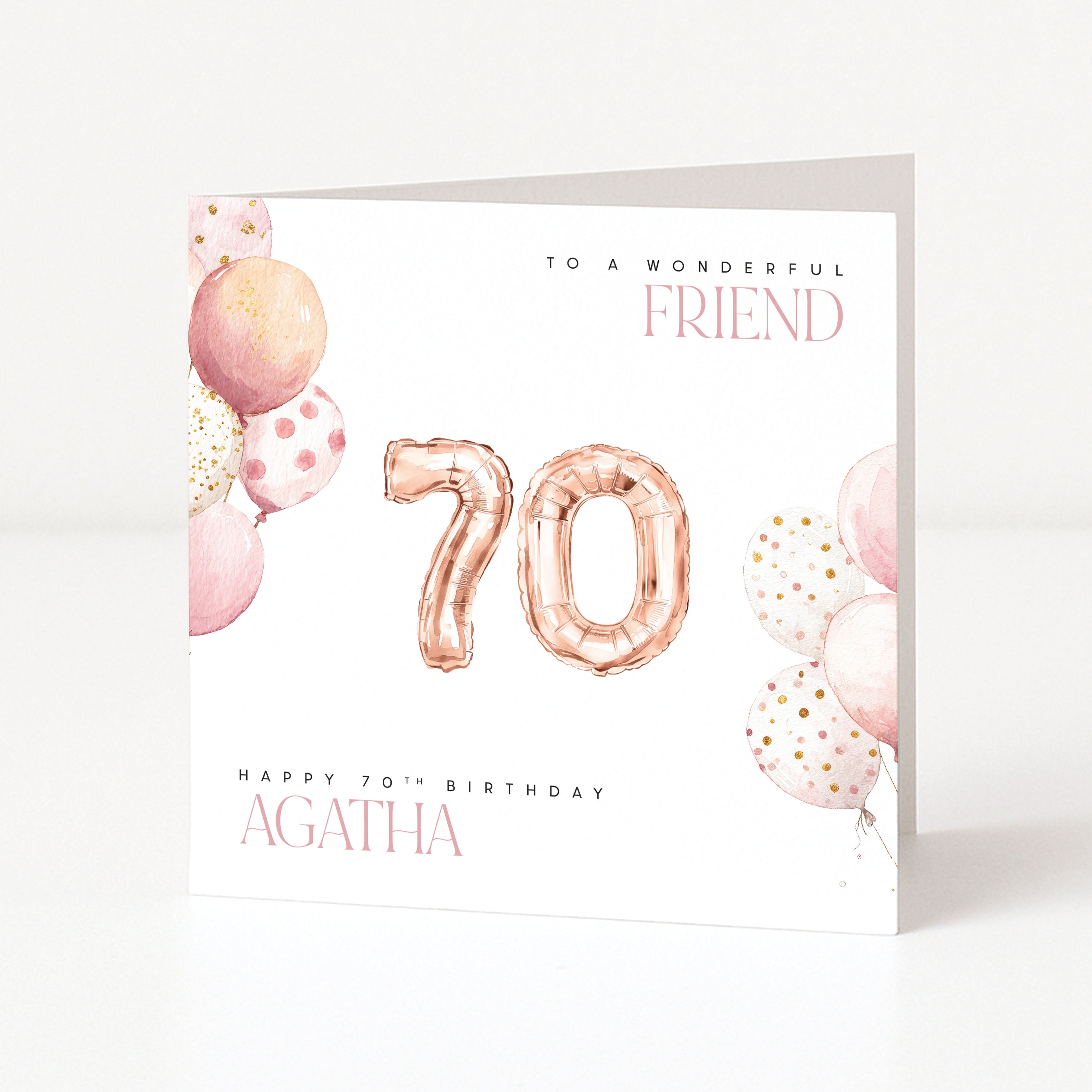 Personalised 70th birthday card for a friend with pink watercolour balloons, rose gold 70 balloons and the name Agatha.
