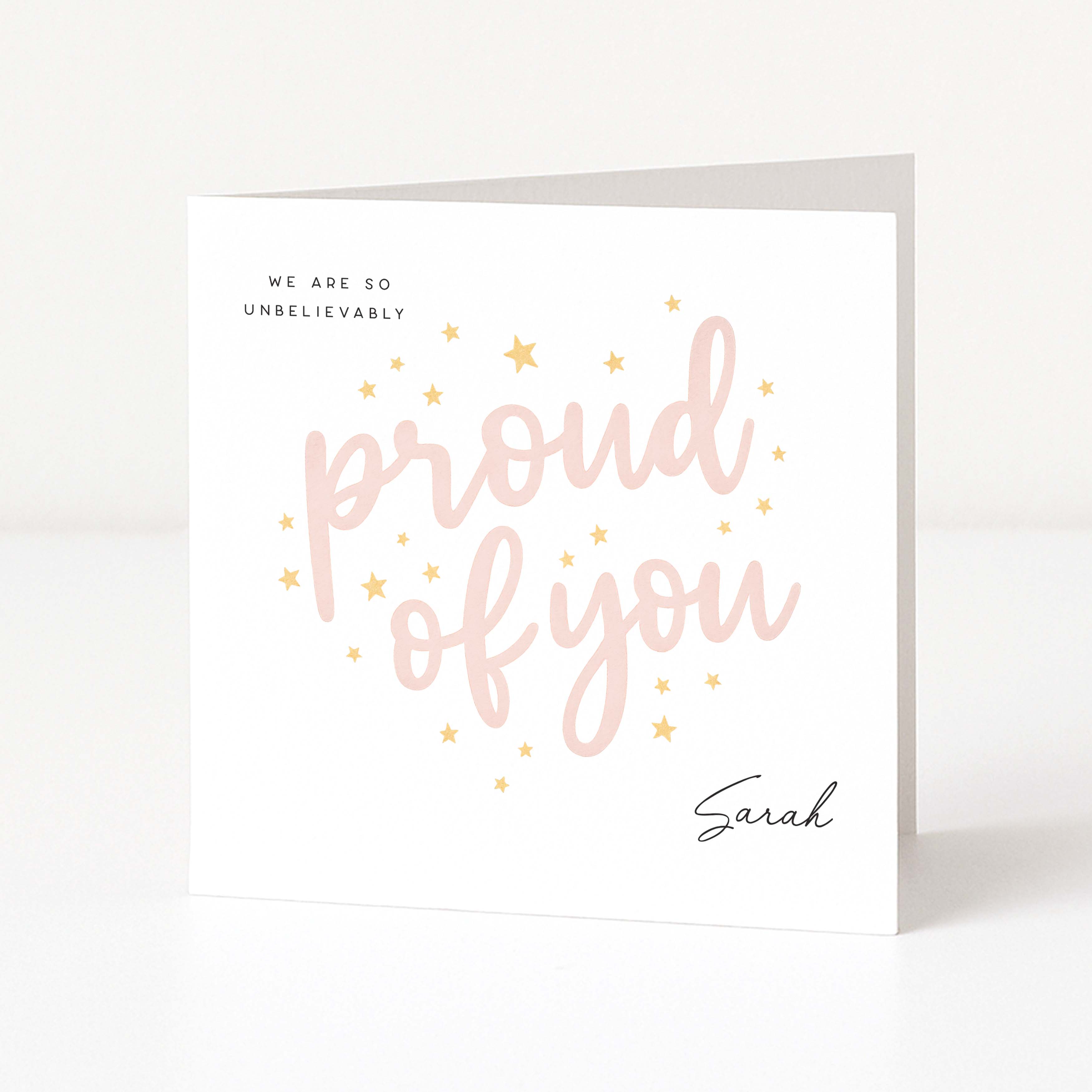 Greeting card with 'proud of you' text on a white background