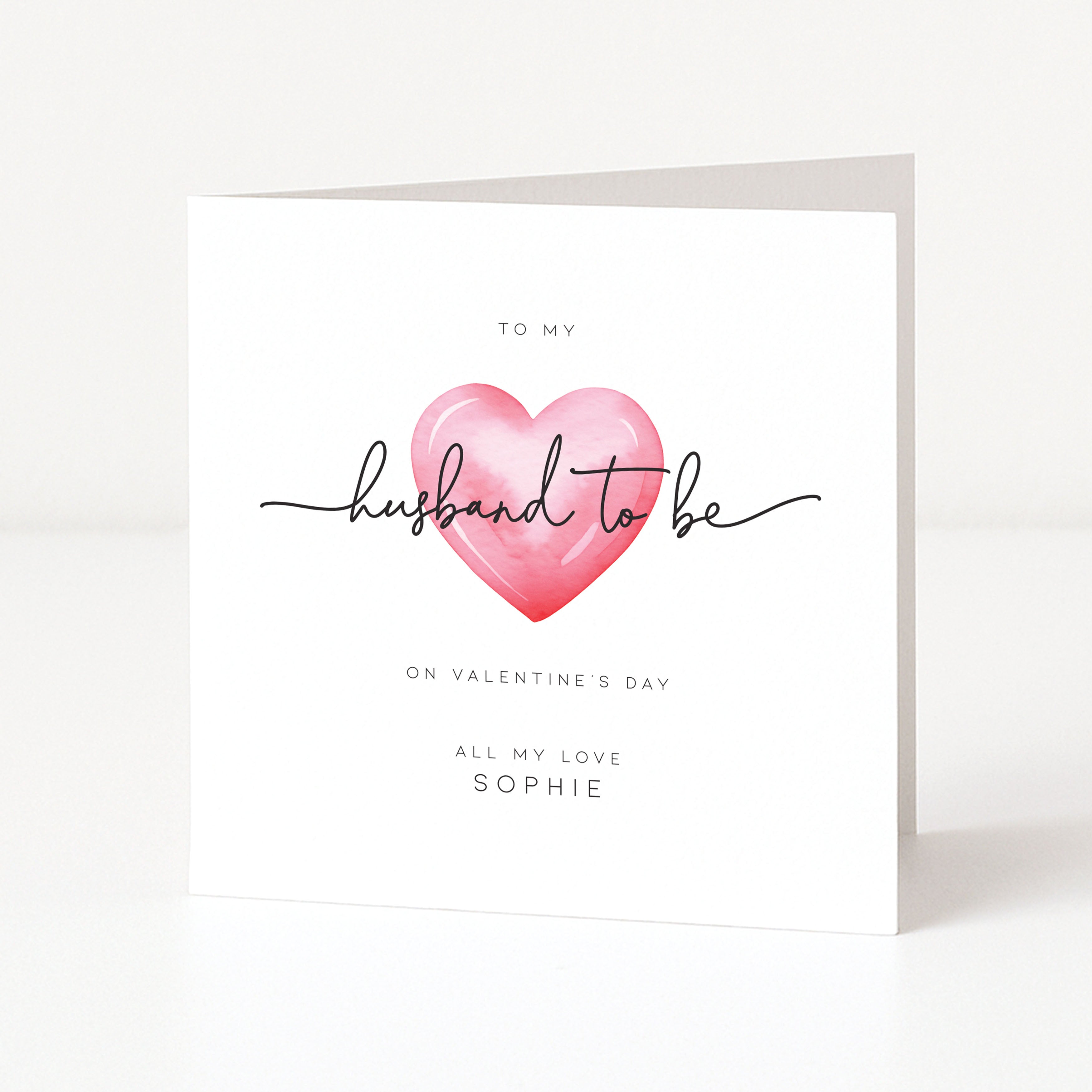 Greeting card with a pink heart and text on a white background