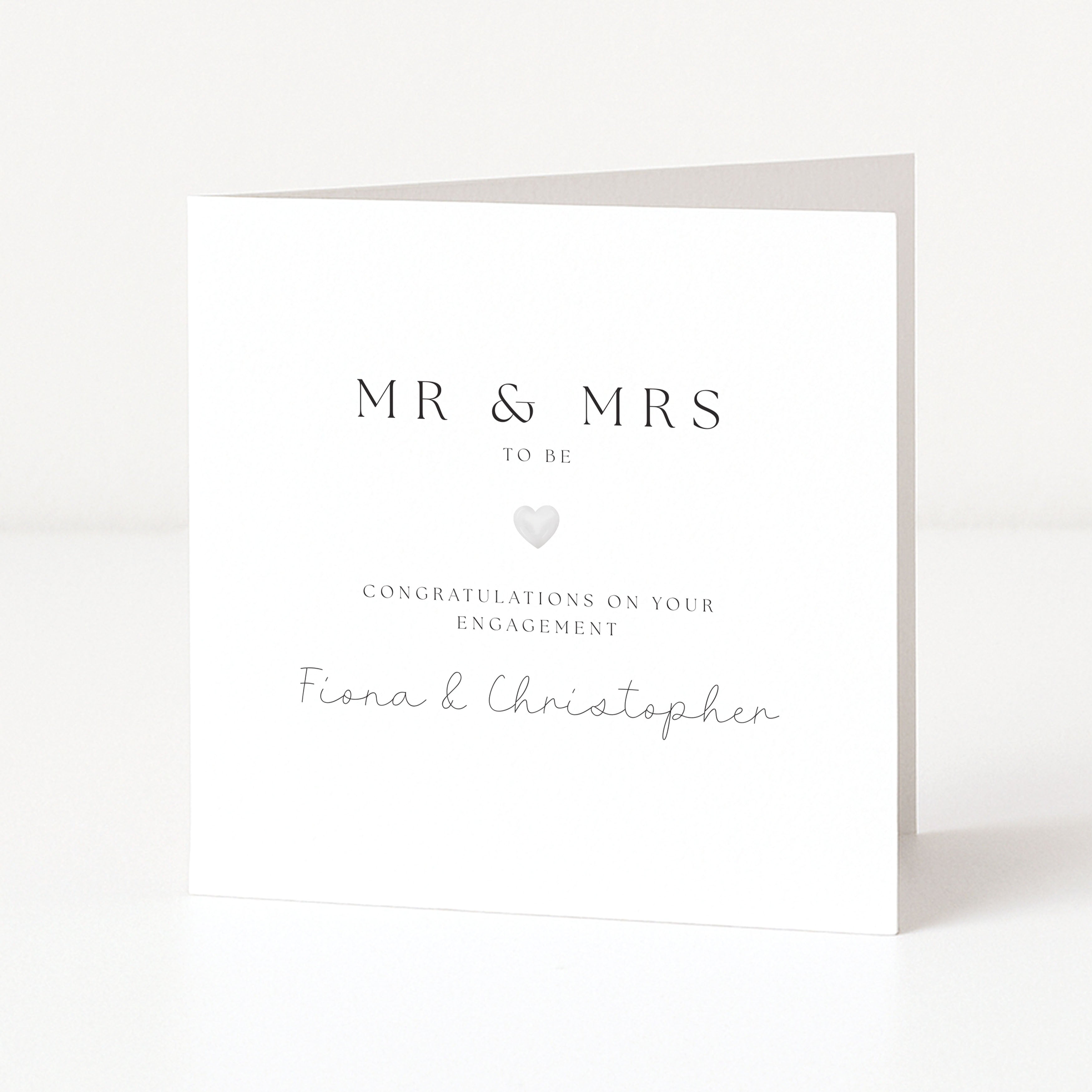 engagement card with mr and mrs and silver heart. on a white background