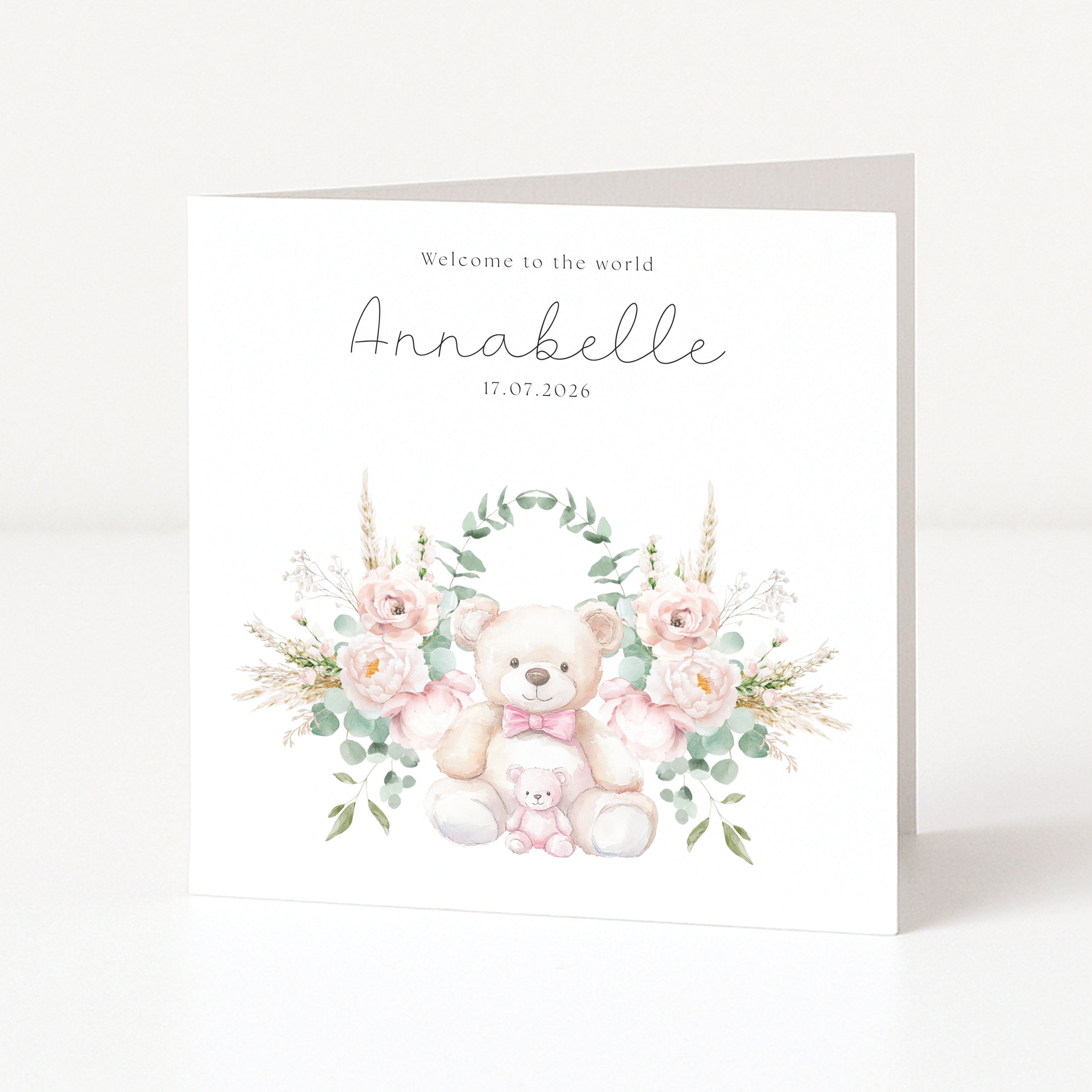 Greeting card with teddy bear and floral design, featuring text 'Welcome to the world Annabelle 17.07.2026'.