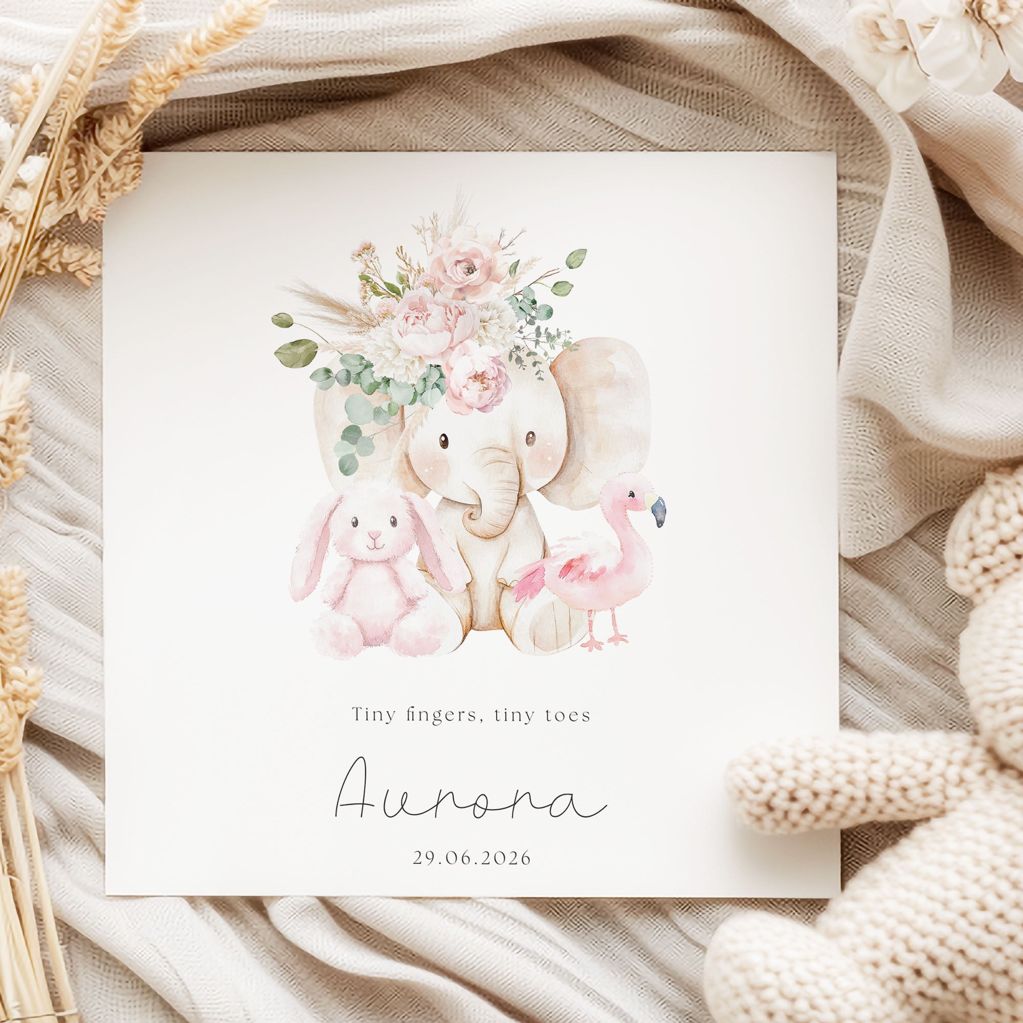 baby girl card with floral elephant on linen background with dried flowers