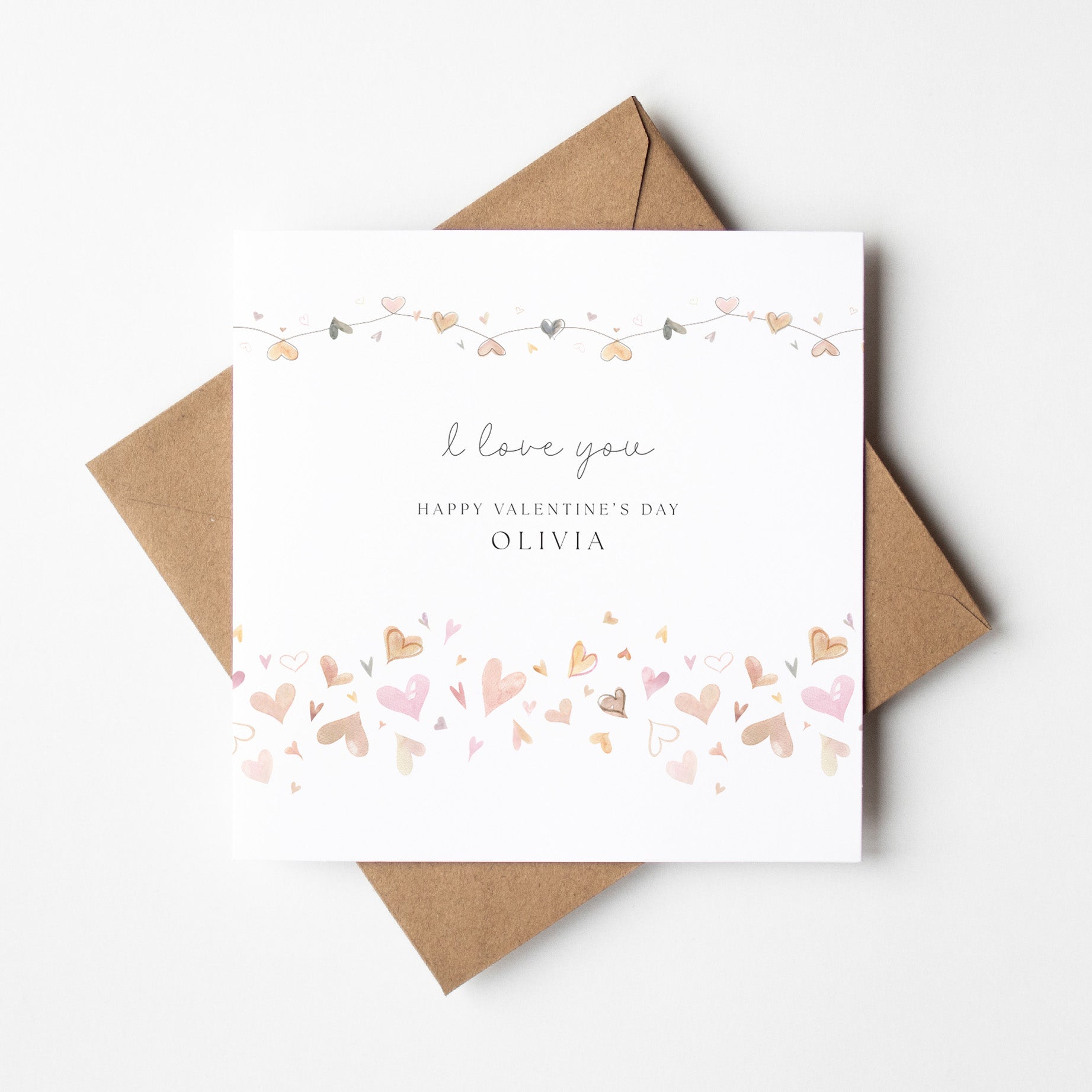 Valentine's Day card with 'I love you' and 'Happy Valentine's Day Olivia' text, surrounded by decorative hearts on a white background.
