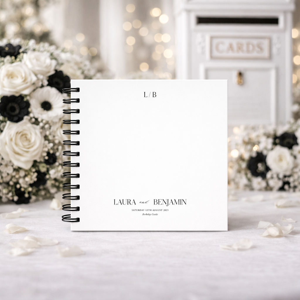 Personalized wedding guestbook with 'Laura & Benjamin' on a decorative background with flowers.