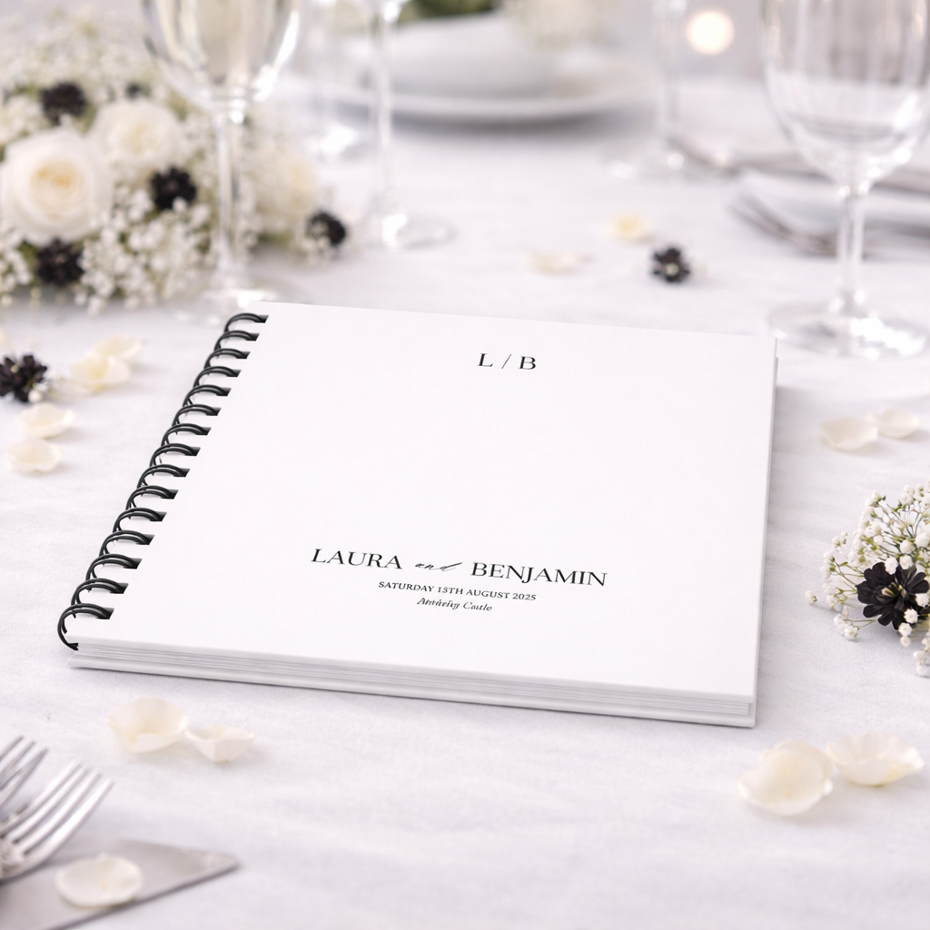 Personalised guestbook on a table with floral decorations
