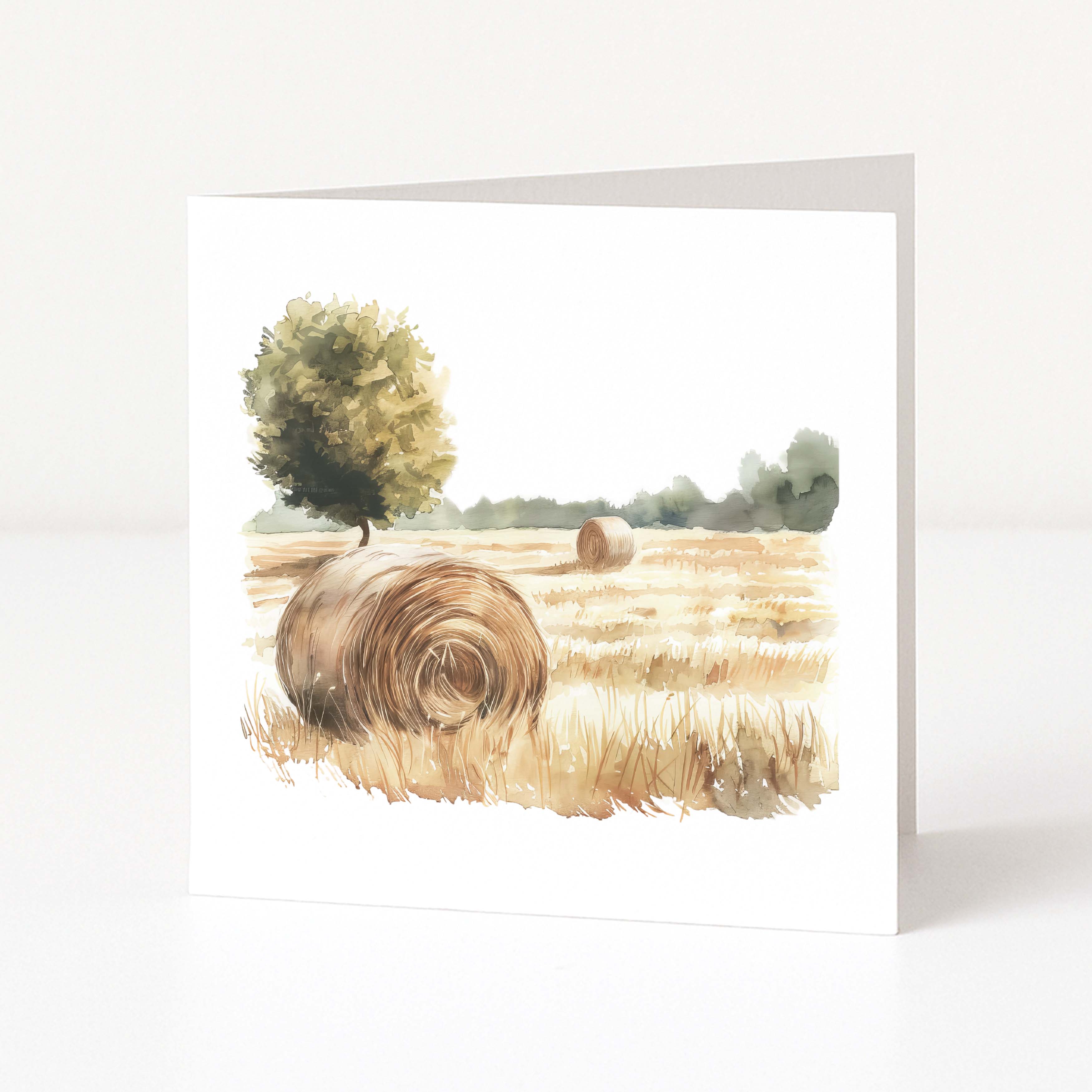 Art print of a field with hay bales and trees on a white background