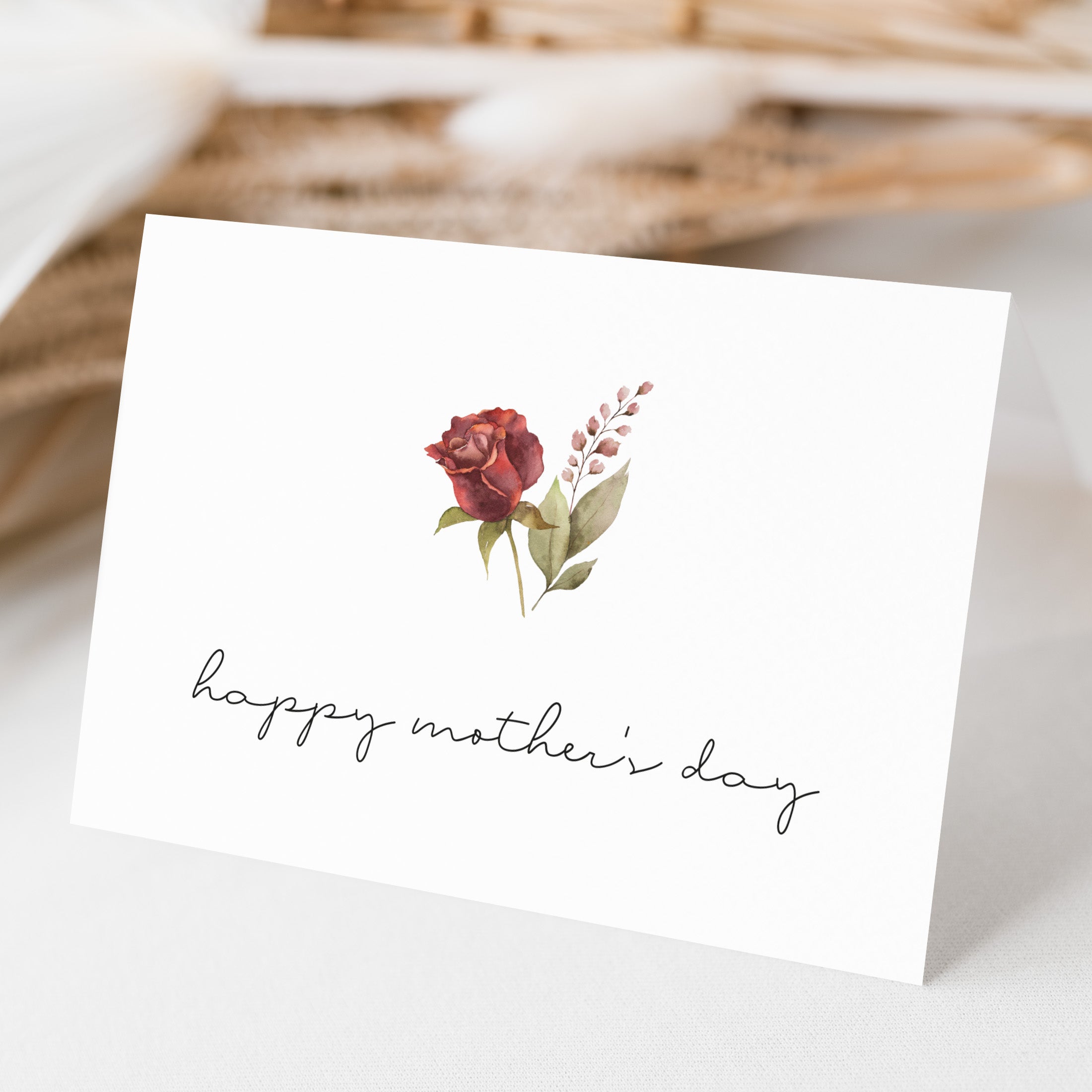 Greeting card with floral design and 'happy mother's day' text on a white background