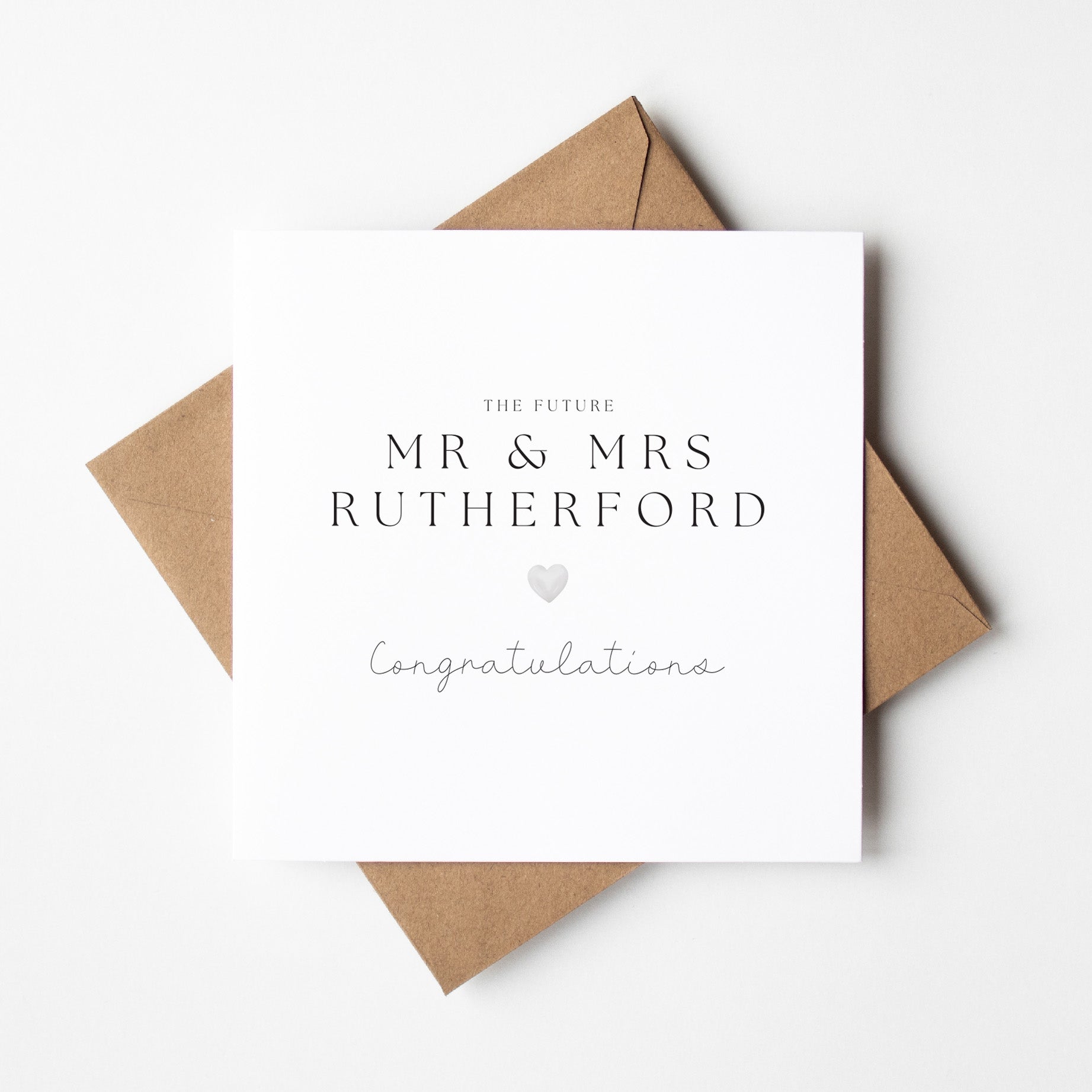 Greeting card with 'The Future Mr & Mrs Rutherford Congratulations' text on a white background with a brown envelope.