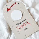 Christmas Countdown Sign with 'Sleeps until Santa visits' text and Santa Claus illustration on a white background.