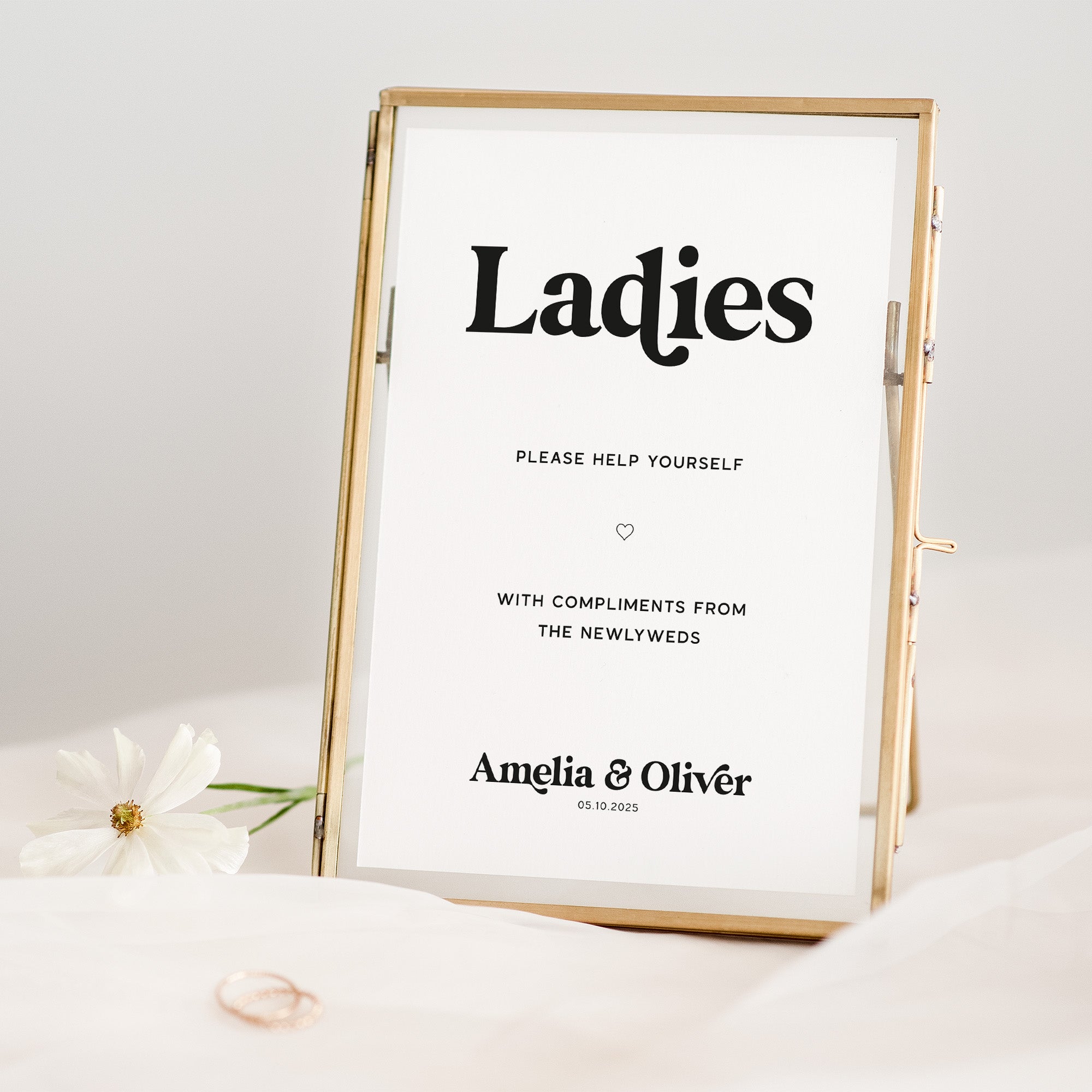 Framed sign with 'Ladies, please help yourself' text on a white background