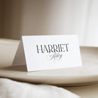 Modern wedding place card placed on a neutral background