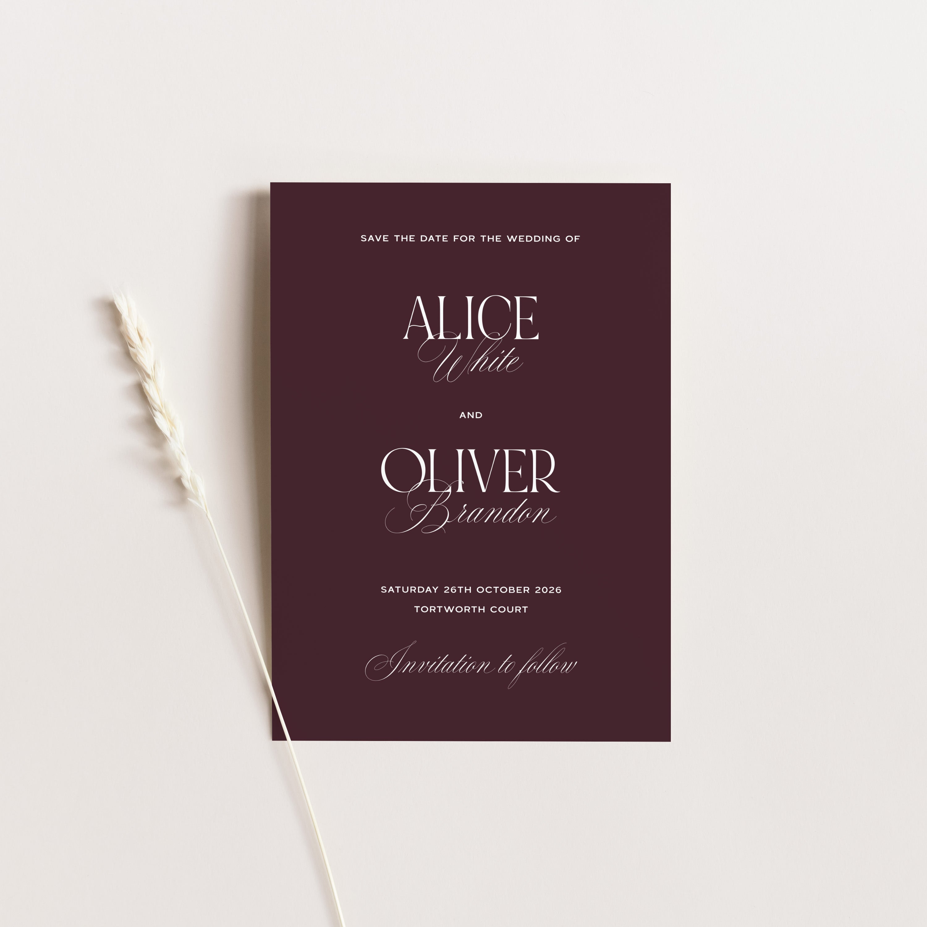 Save the date card for Alice and Oliver with a maroon background