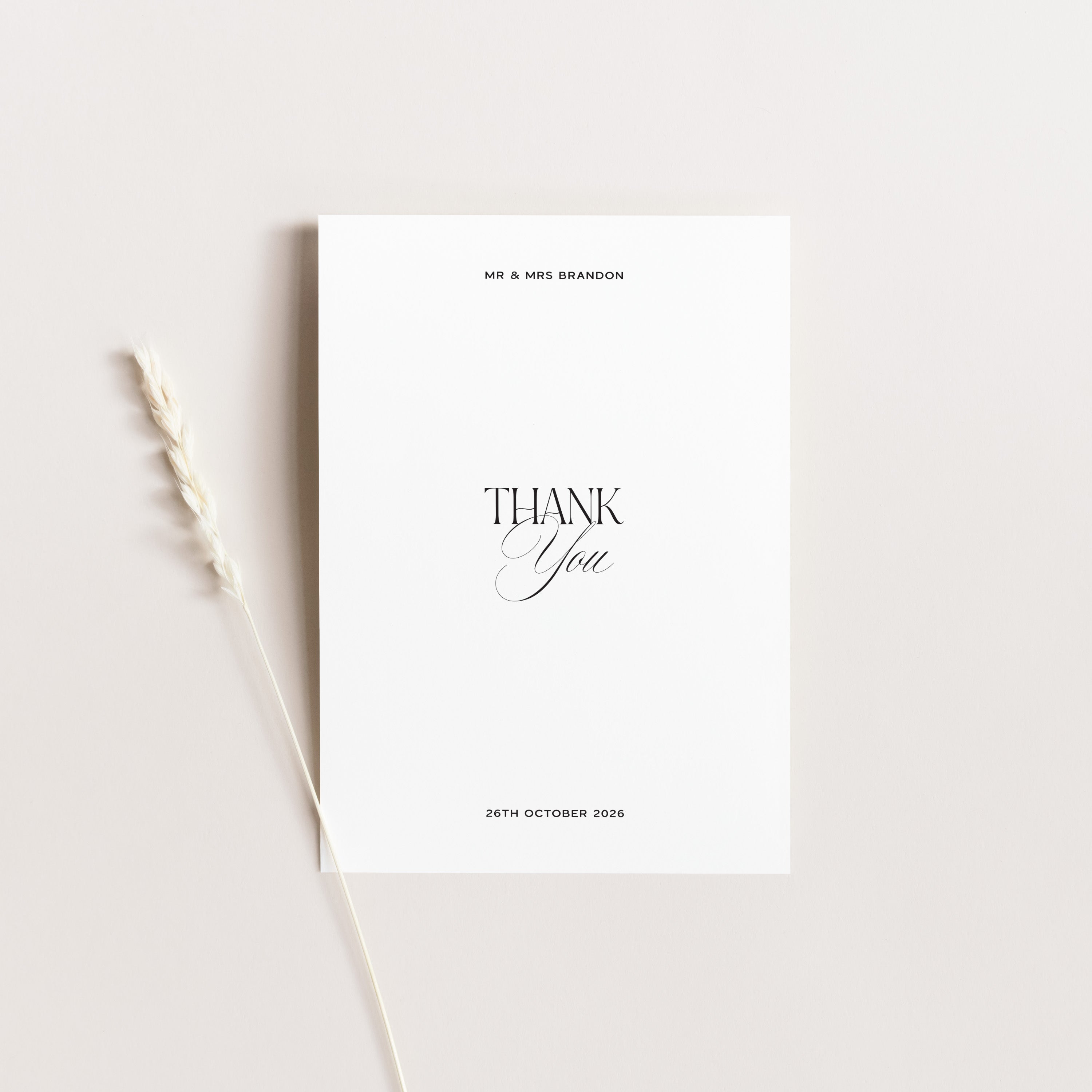 Personalised wedding thank you card in white on a light gray background