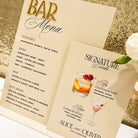 Bar menu with cocktail illustrations on a gold glittery background