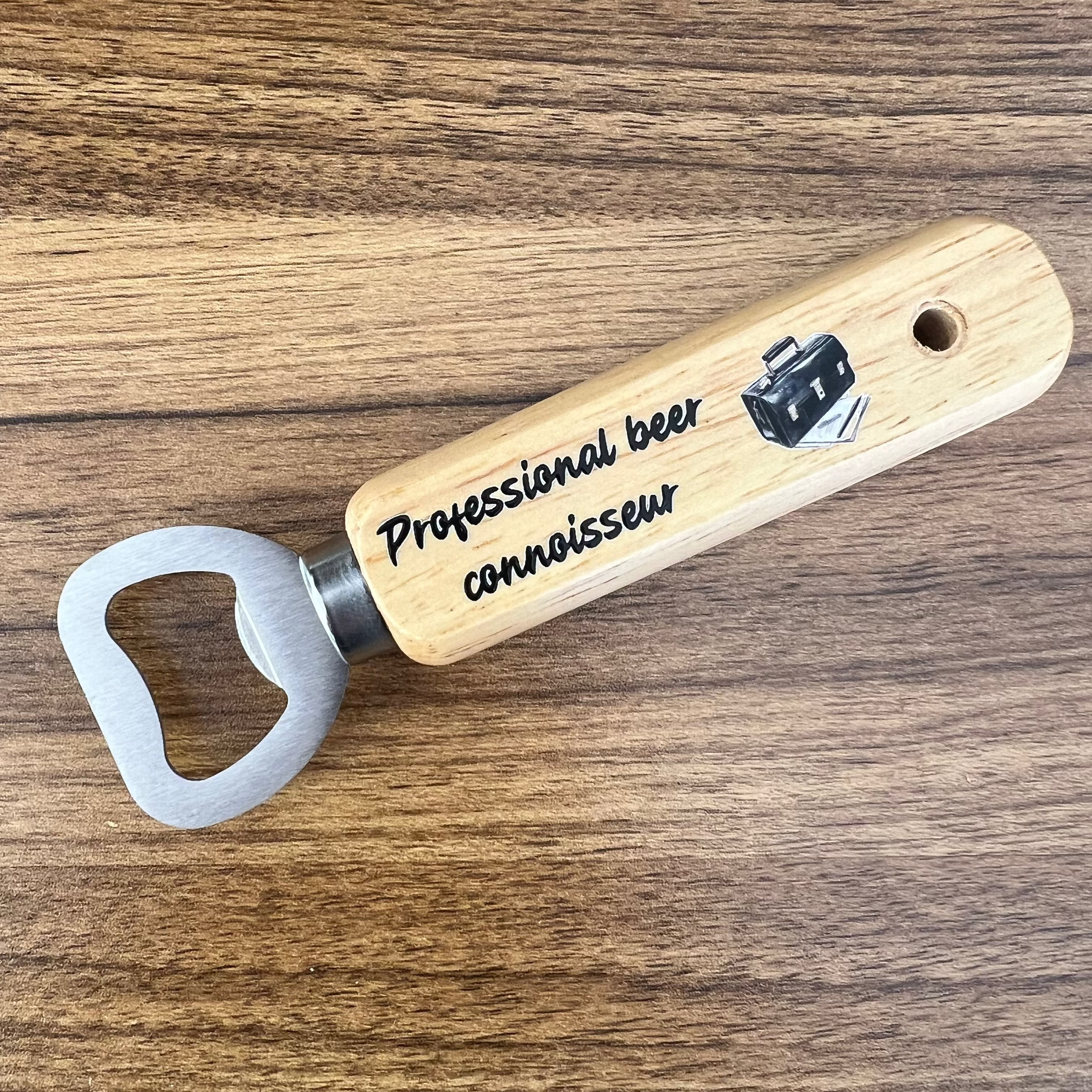 wooden bottle opener with professional beer connoisseur printed on the handle