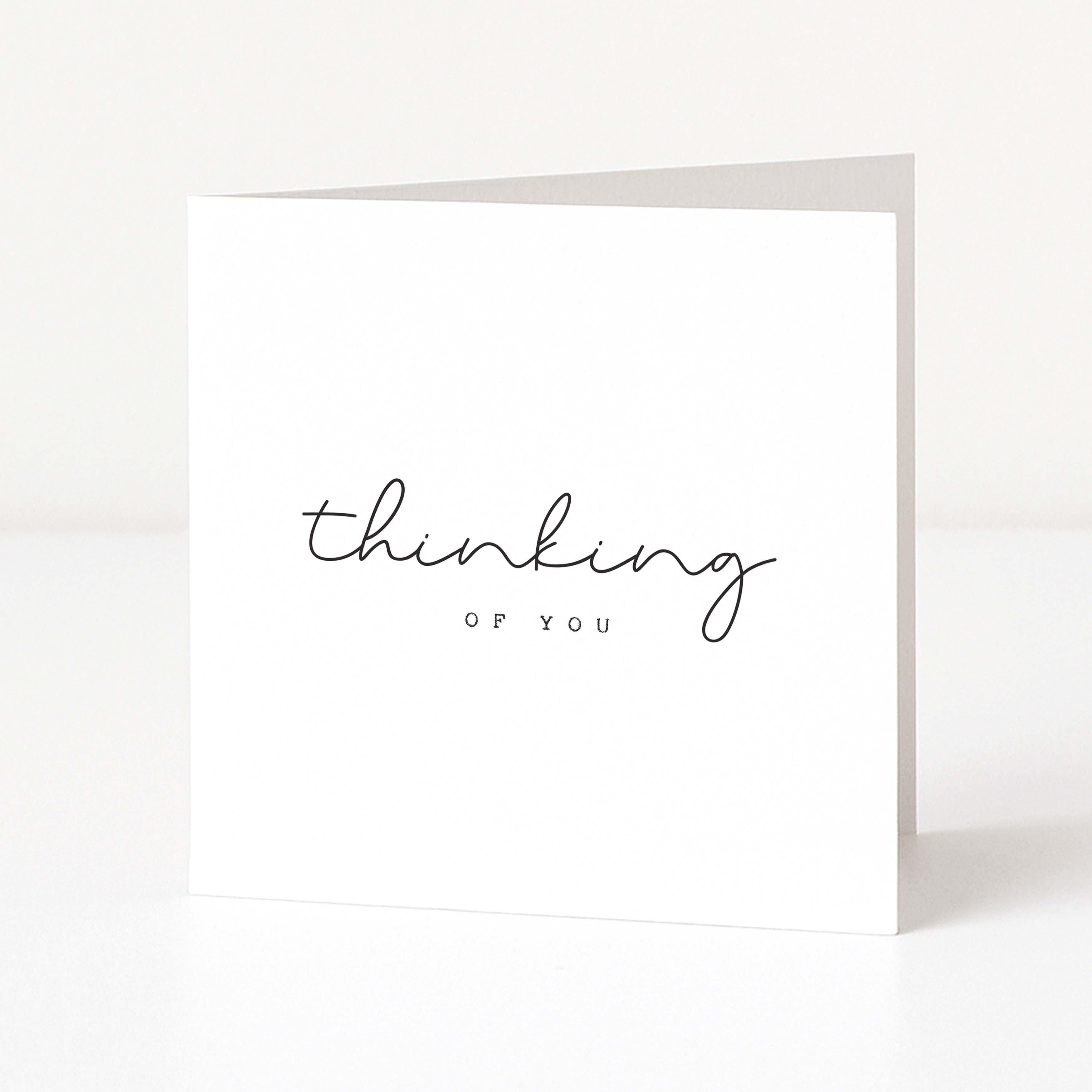 Greeting card with 'thinking of you' text on a white background