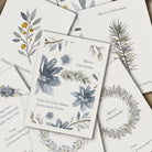 Collection of Christmas cards with floral and wreath designs on a white background.
