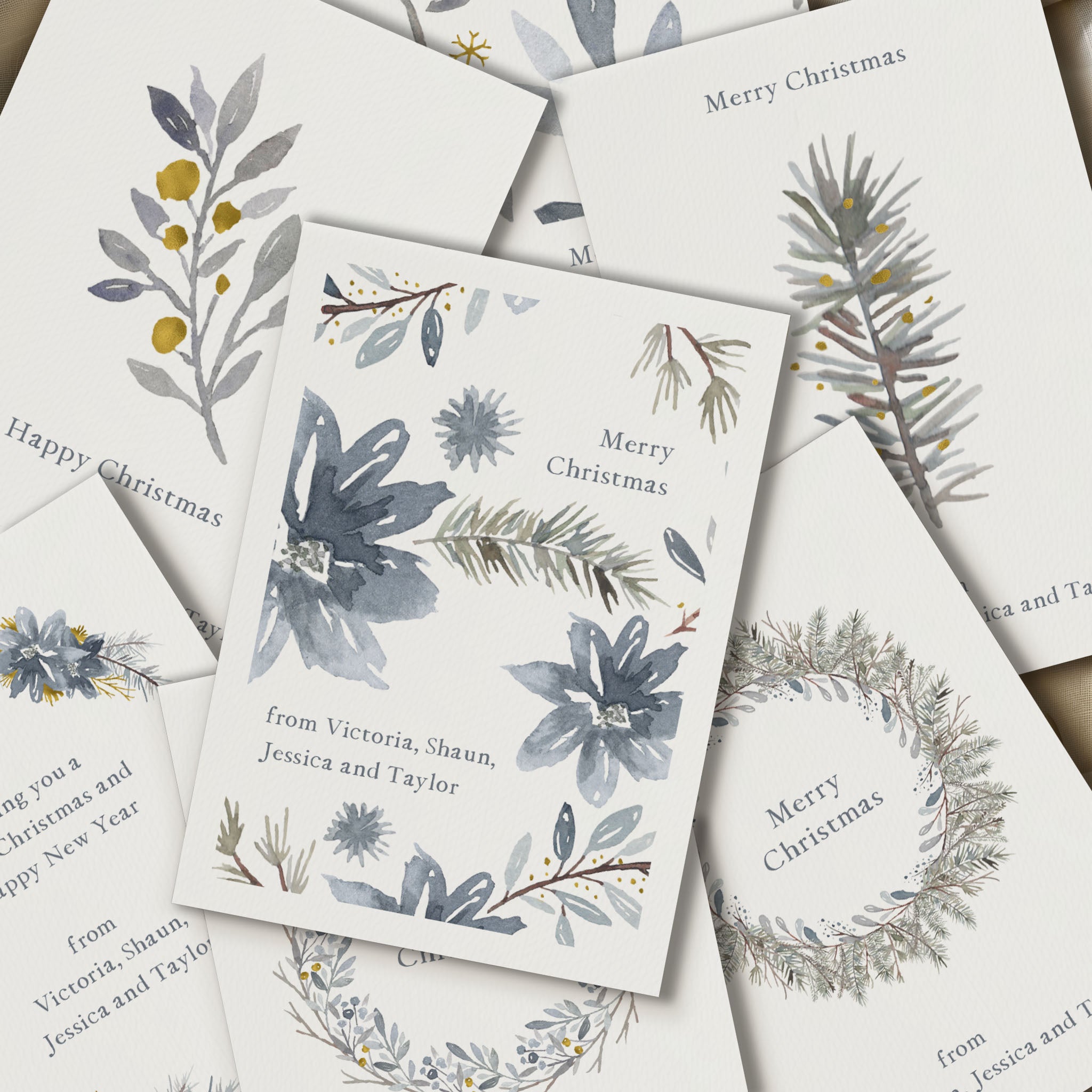 Collection of Christmas cards with floral and wreath designs on a white background.