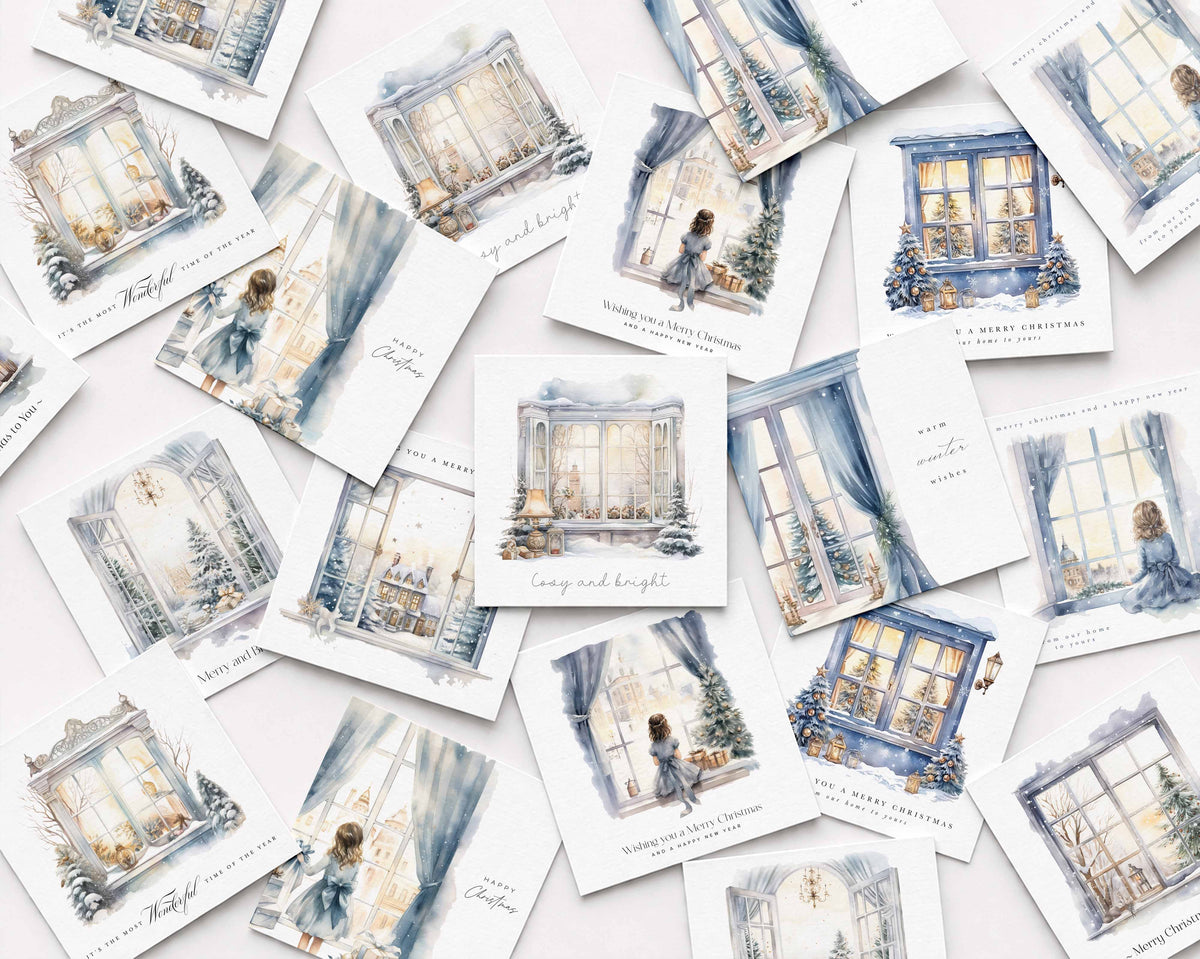 A scattered arrangement of small illustrated cards featuring watercolour-style Christmas window scenes in soft blue, cream, and gray tones, with handwritten and printed holiday text on a light background.
