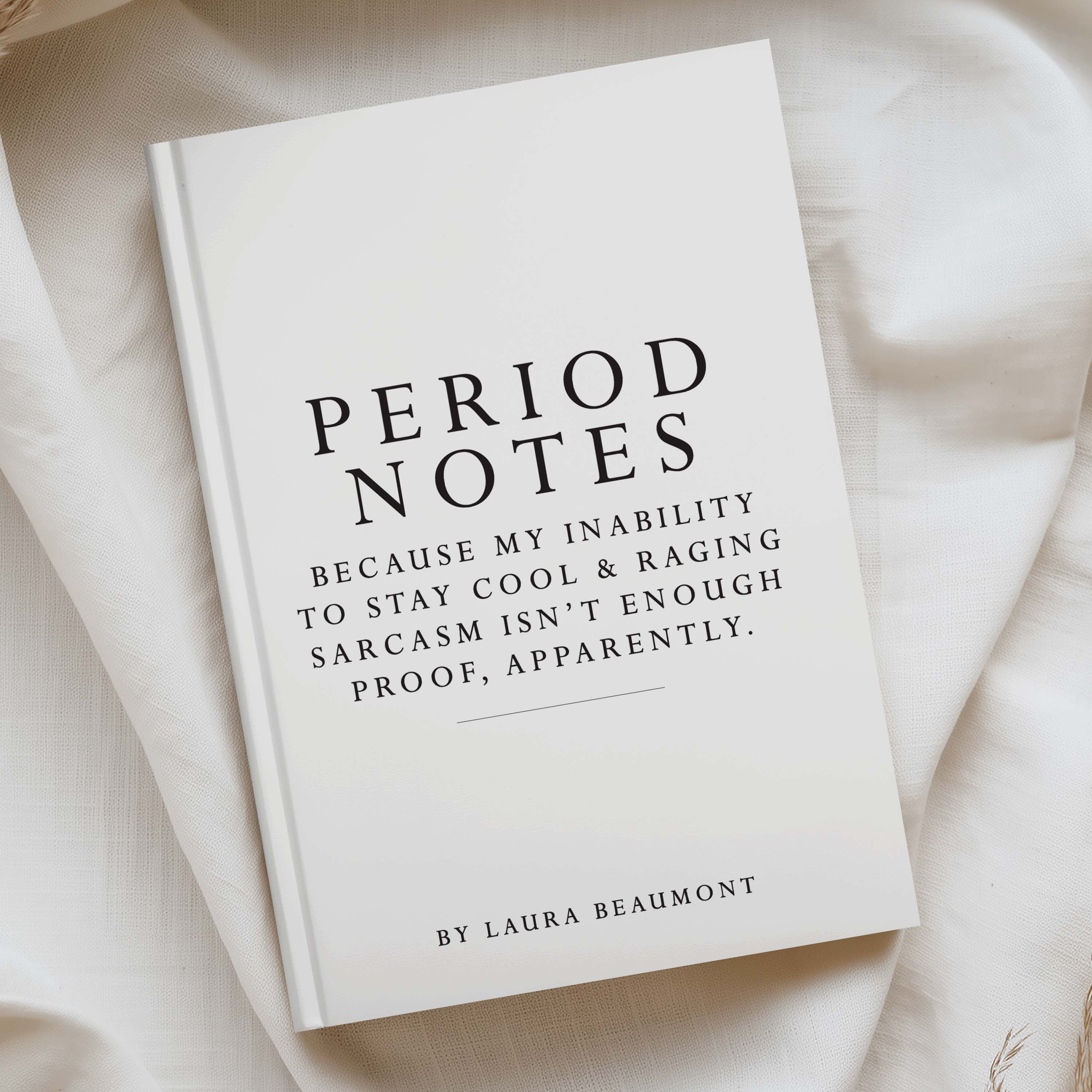 A hardcover book titled 'Period Notes' by Laura Beaumont, lying on draped cream fabric. The cover is white with black serif text and a thin horizontal line near the bottom.