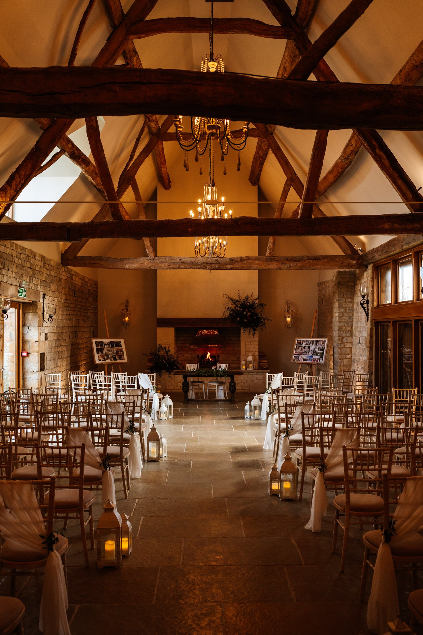 Blackwell grange ceremony room set up with a red, blush and greenery feel