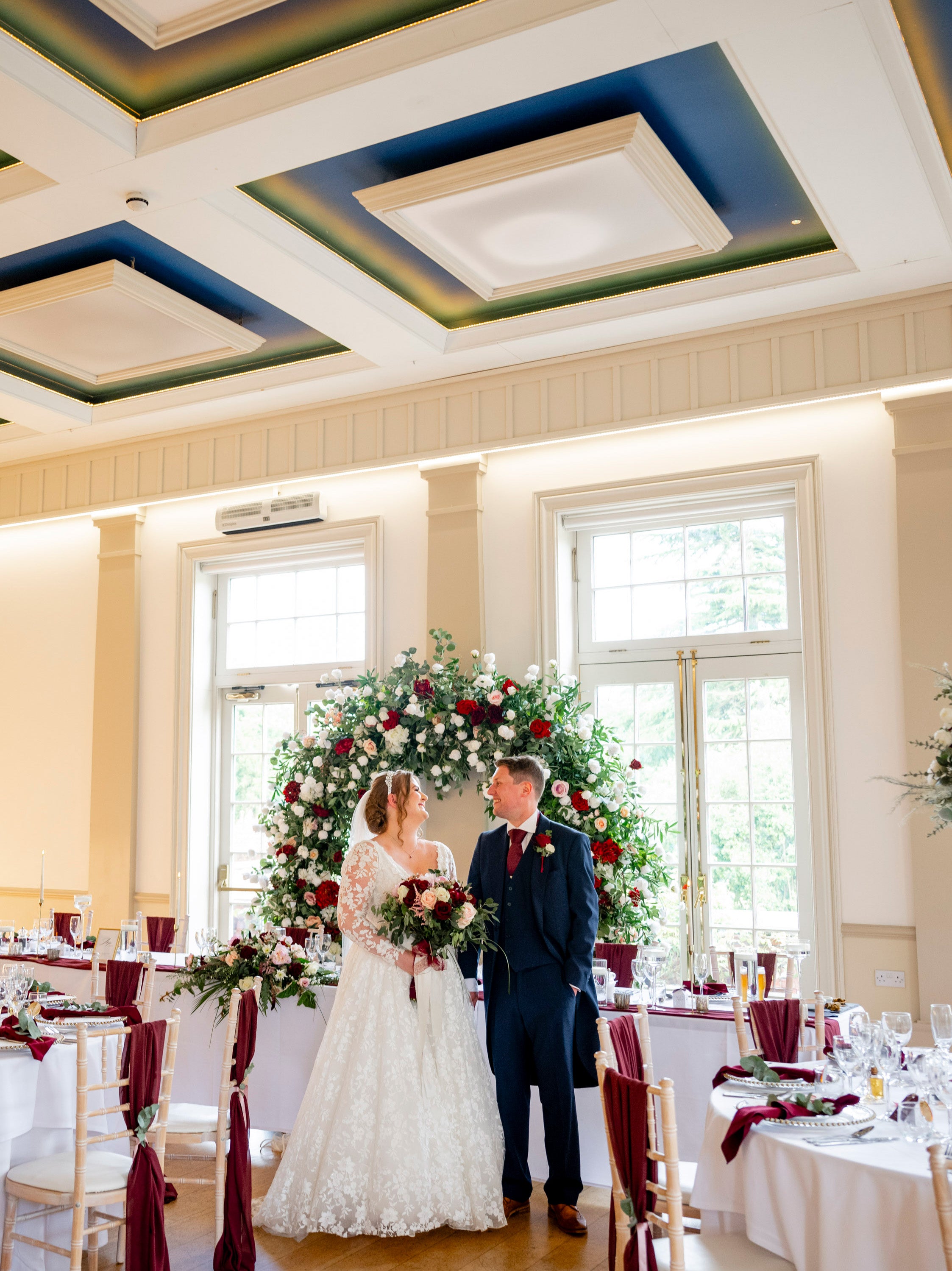 Bride and groom at hodsock priory, with a burgundy and blush wedding theme