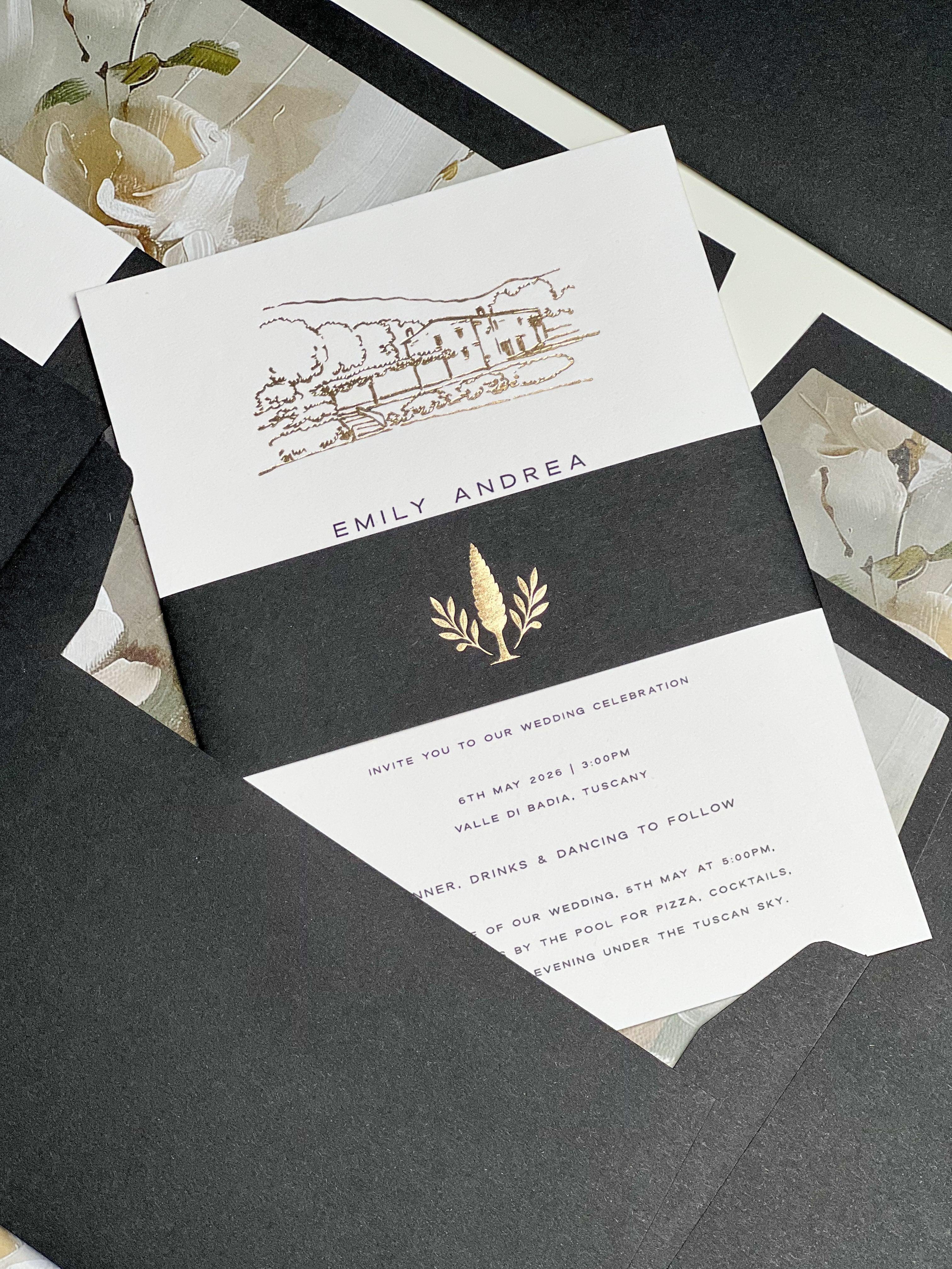 Black and Gold foil wedding invitation with foil wedding venue sketch, laid flat across black envelope with printed envelope liners