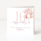 Greeting card with pink balloons and 'happy birthday' text on a white background