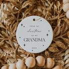 Decorative ornament with 'Your 1st Christmas as my Grandma 2025' text on a gold and beige background.
