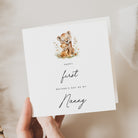 Greeting card with lion and cub illustration and text on a neutral background