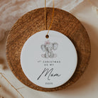 Decorative plaque with an elephant illustration and text on a wooden disc.