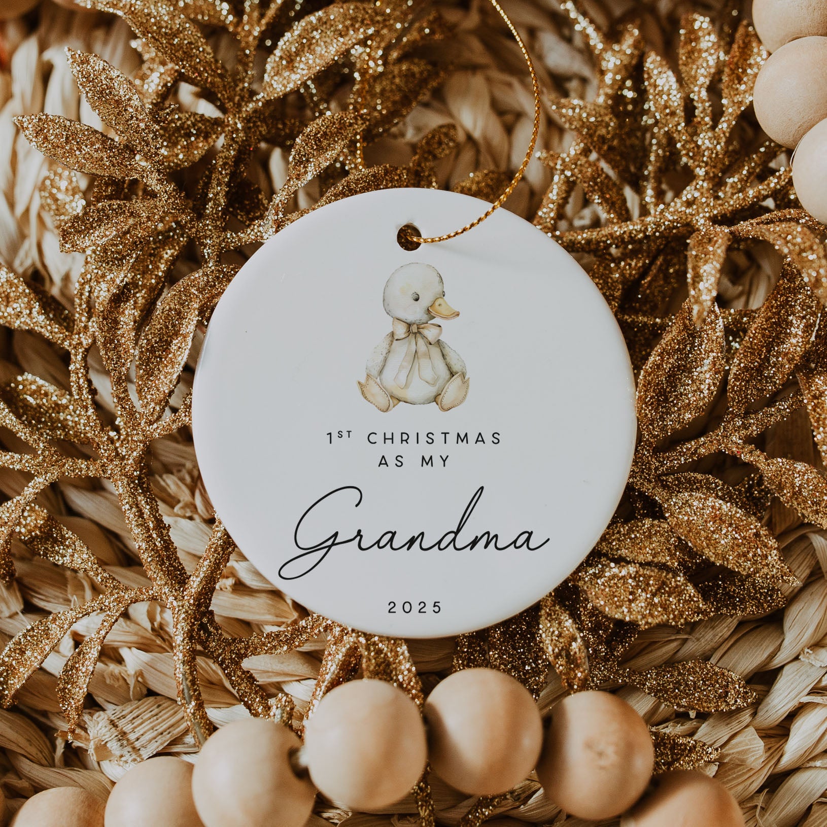 Decorative ornament with a baby duck illustration and text on a textured background